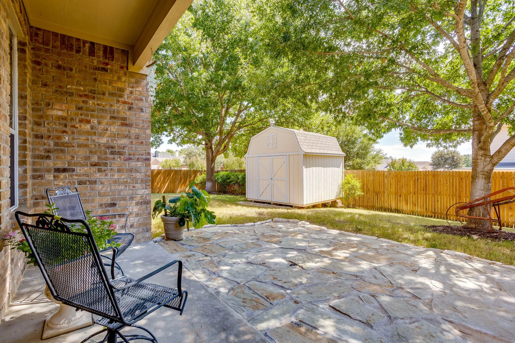 Covered patio overlooking the backyard.