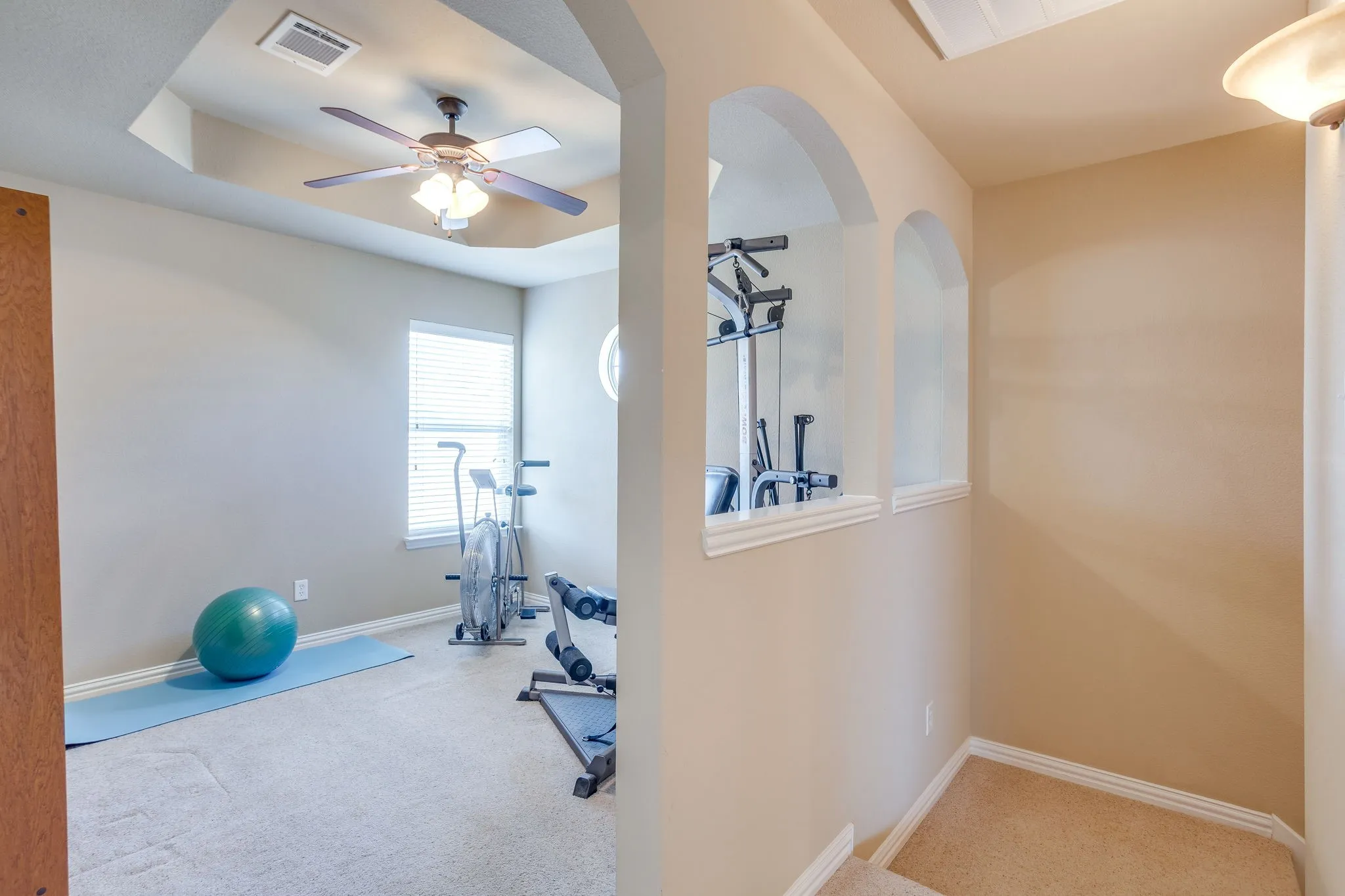 Wonderful flex space upstairs! Extra TV room, playroom, the choice is yours!  Tray ceiling, carpet, natural light and ceiling fan. Beautiful architectural details.