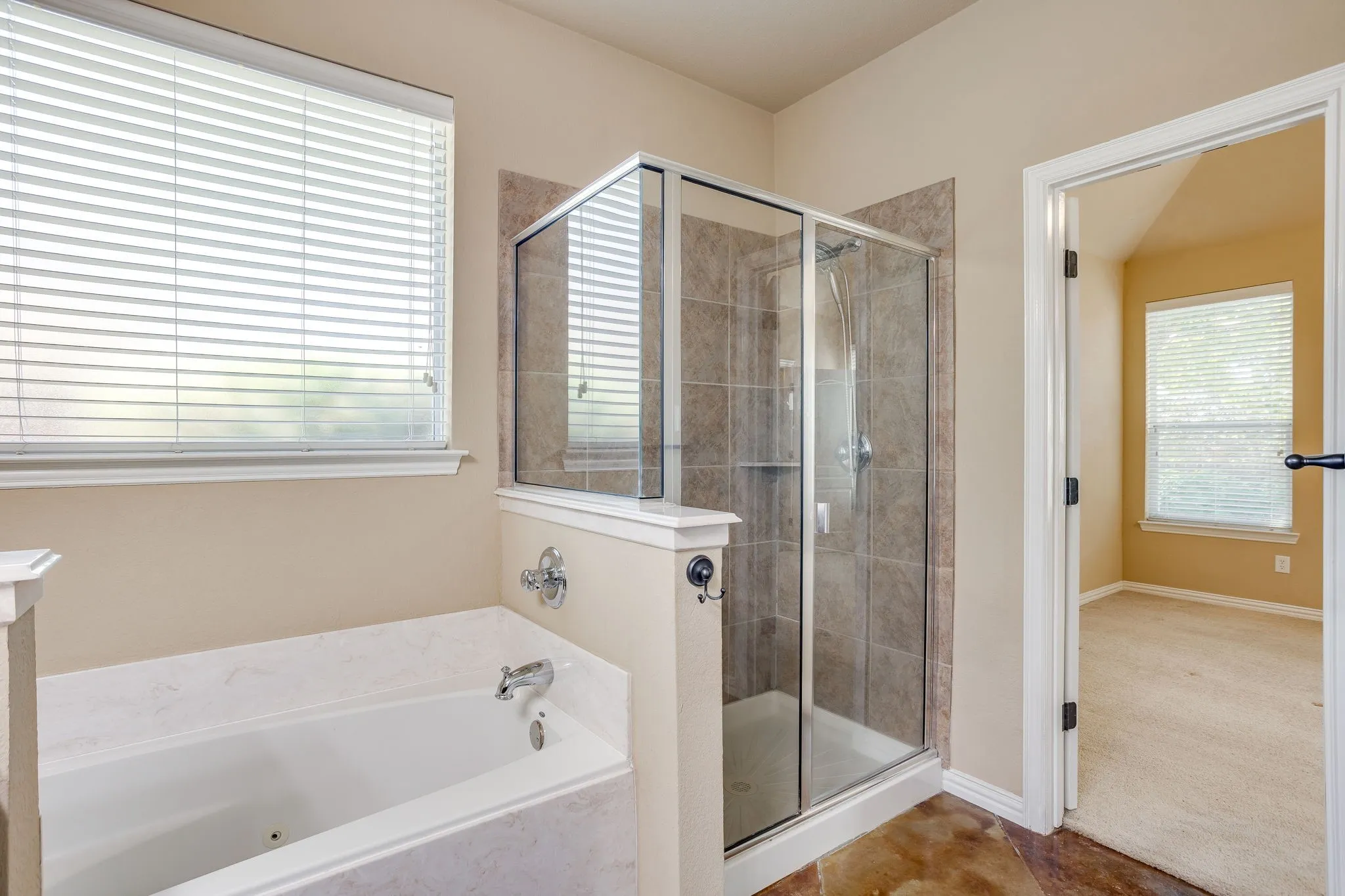Jetted bathtub and separate walk in shower.