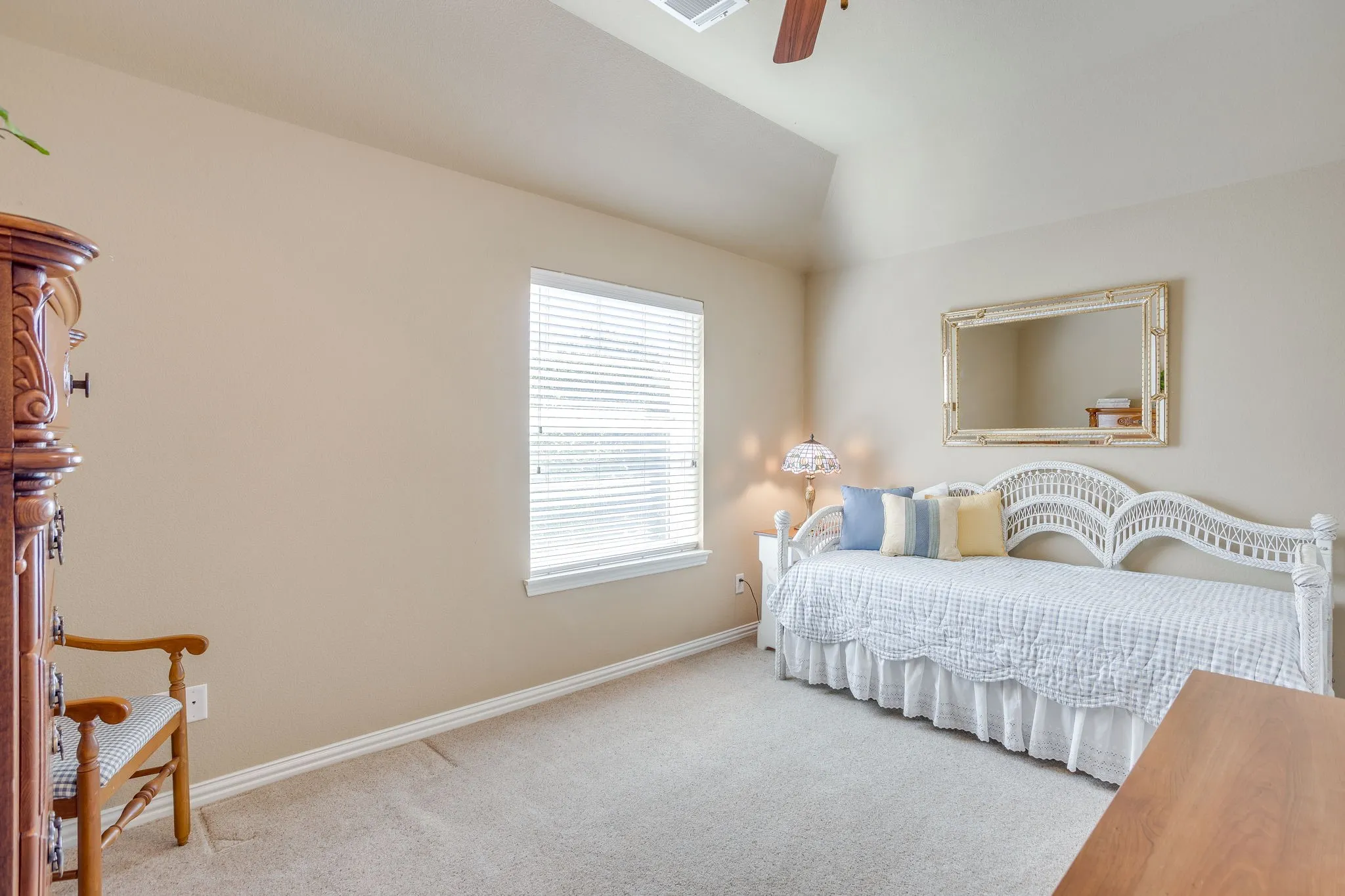 Upstairs Guest bedroom is generously sized with a nice closet.  Carpeted floors, ceiling fan and window.