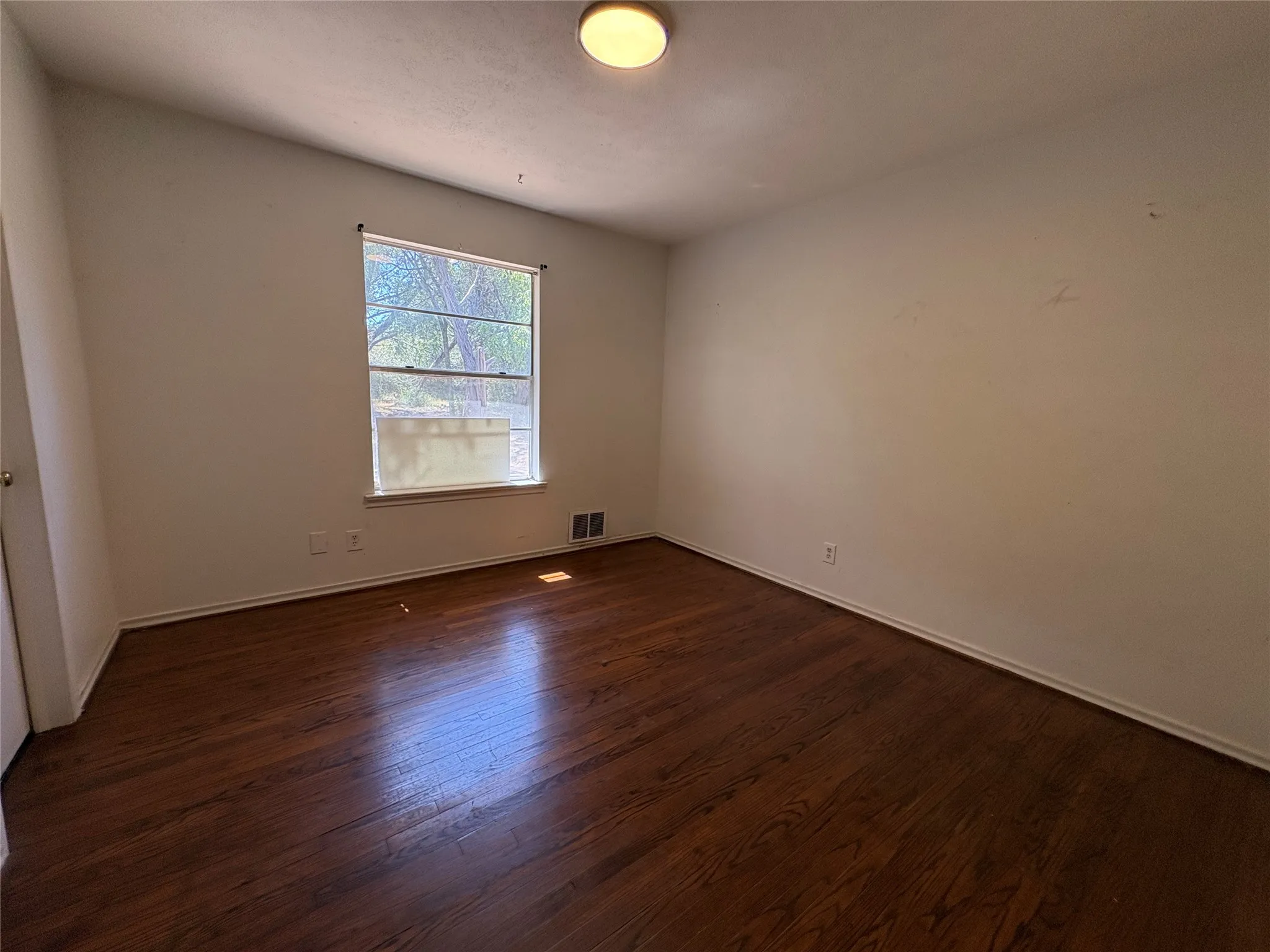 Hardwood flooring, recessed window, and flush mount lighting