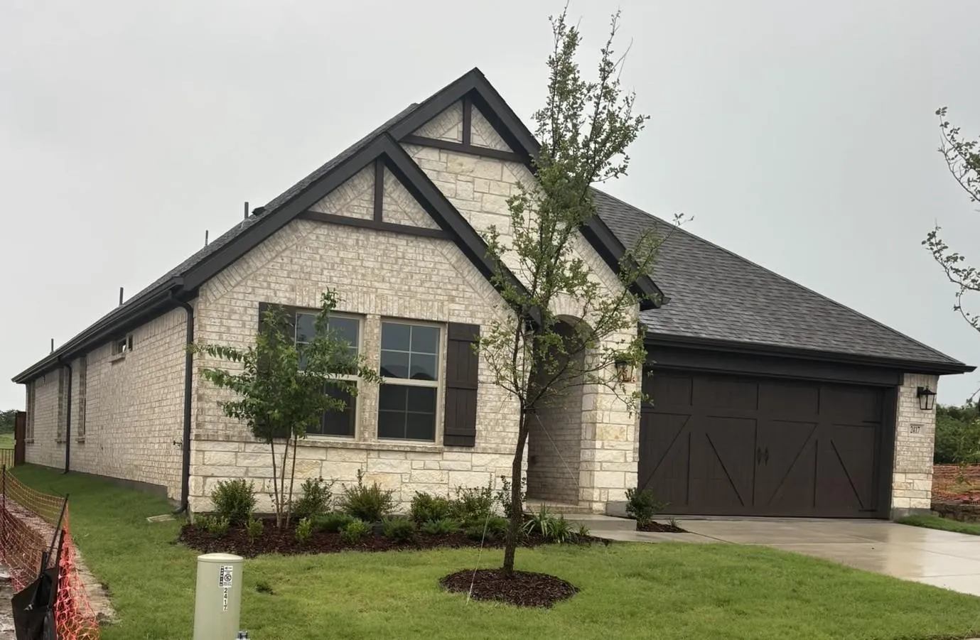 Stone and brick exterior with dark trim accents
