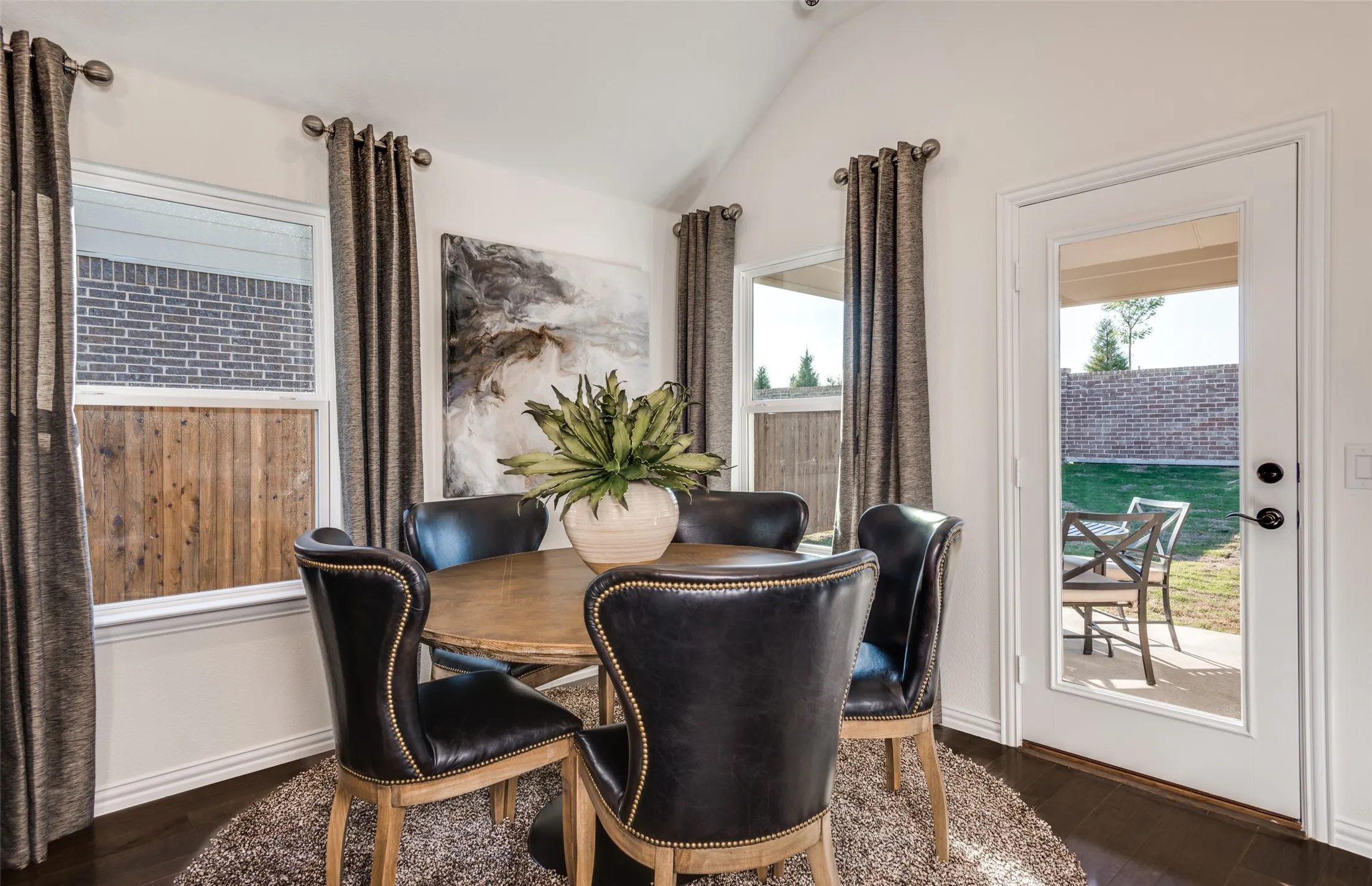*Model Representation - Dining area off kitchen with large windows