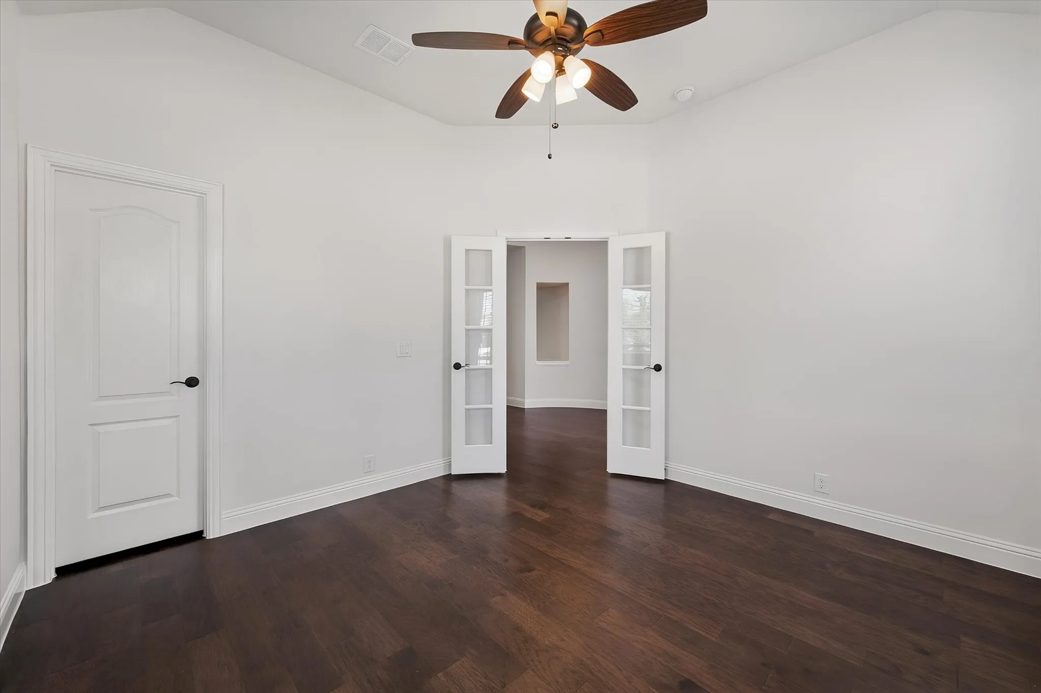 And check out these glass French doors leading into the next room — such an elegant touch, and it lets light travel between spaces.