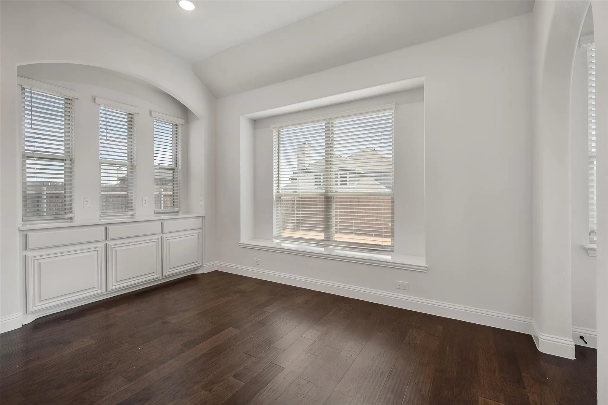 I love this little built-in under the windows — extra counter and storage space that catches all that natural light.