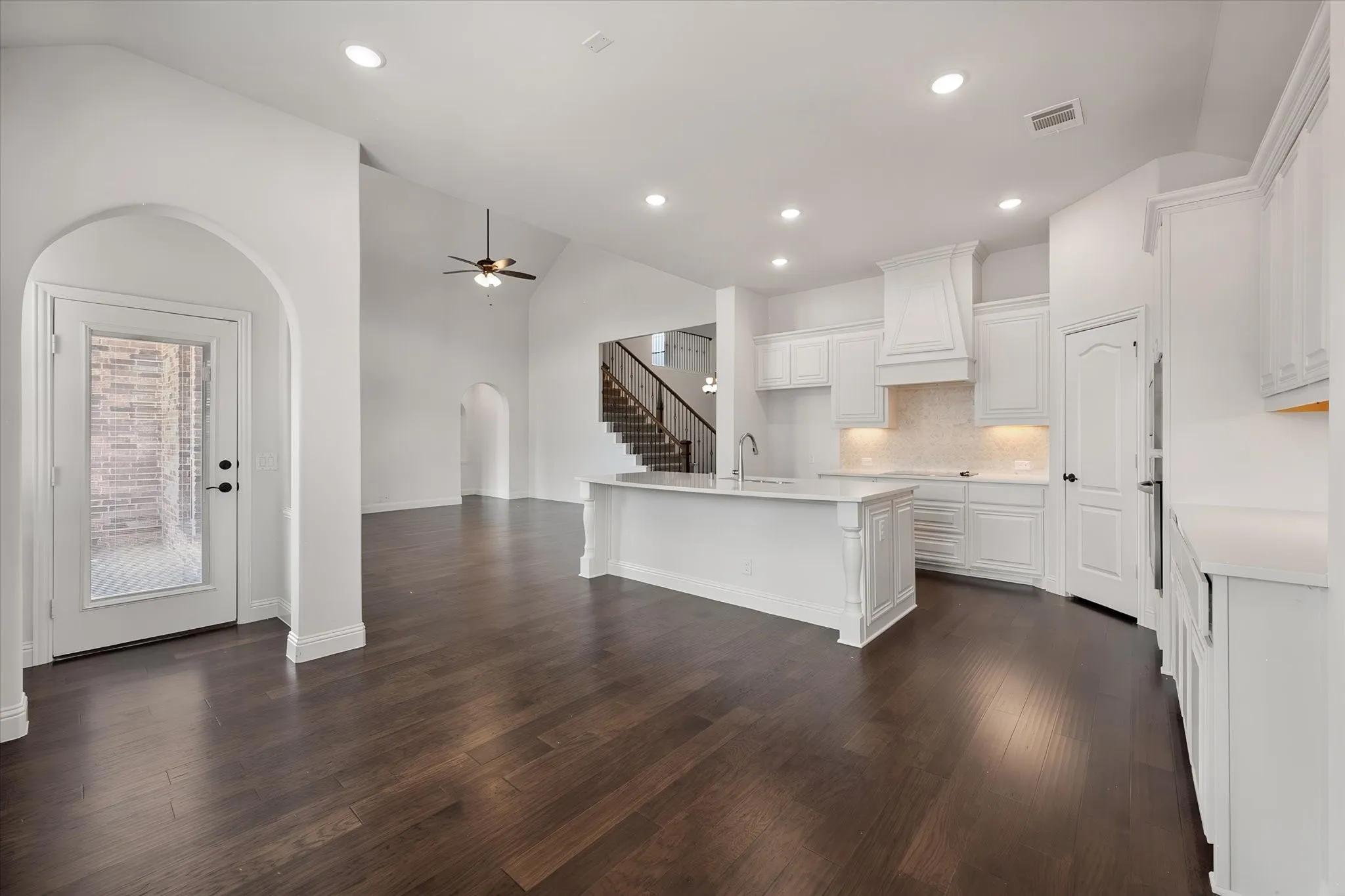 One more look at that beautiful kitchen from a different angle — you can really appreciate how the cabinetry wraps around and how much natural light comes through.