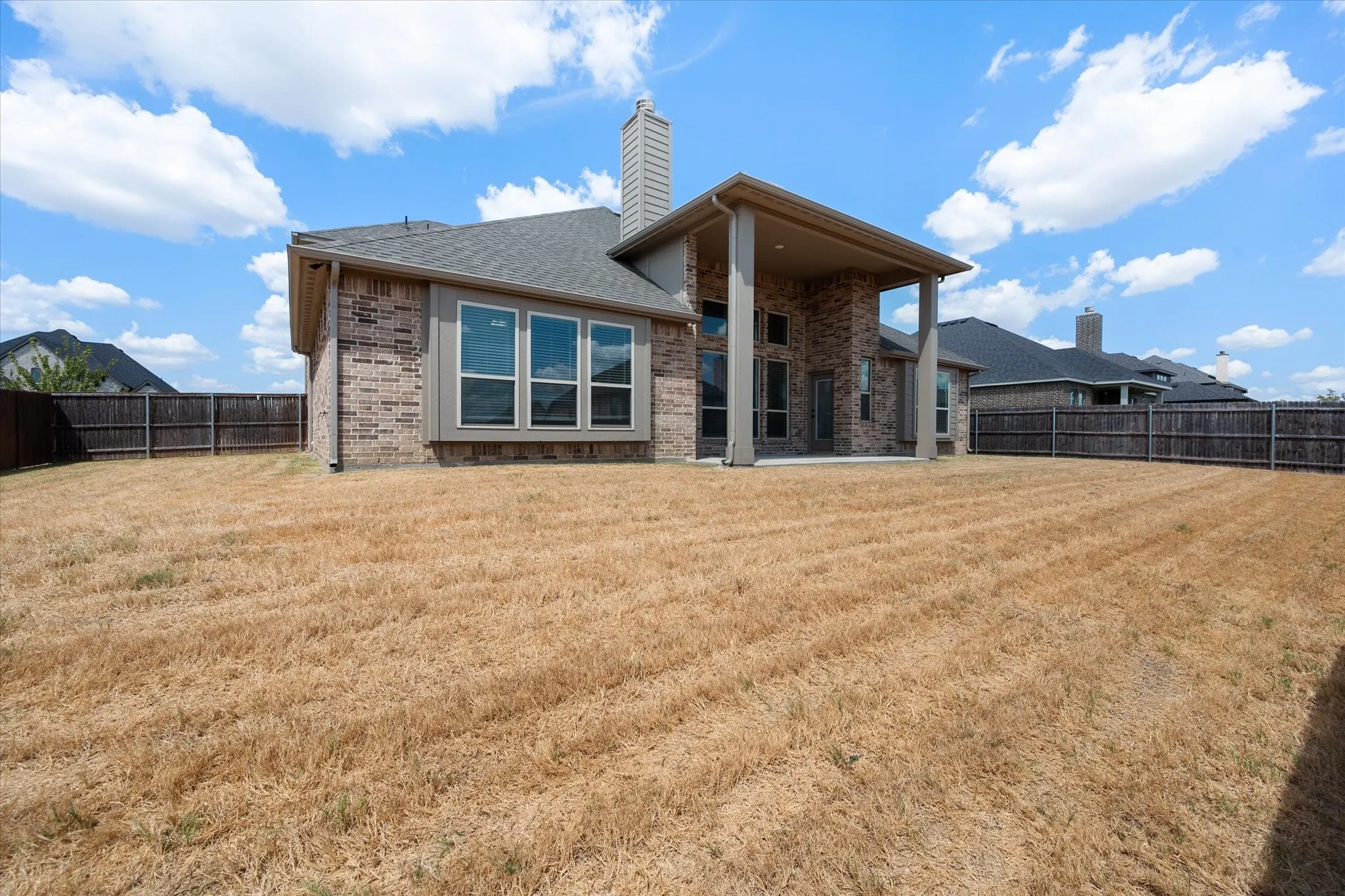 From this angle you get a feel for the lot size and how private the backyard is with privacy fencing all around.
