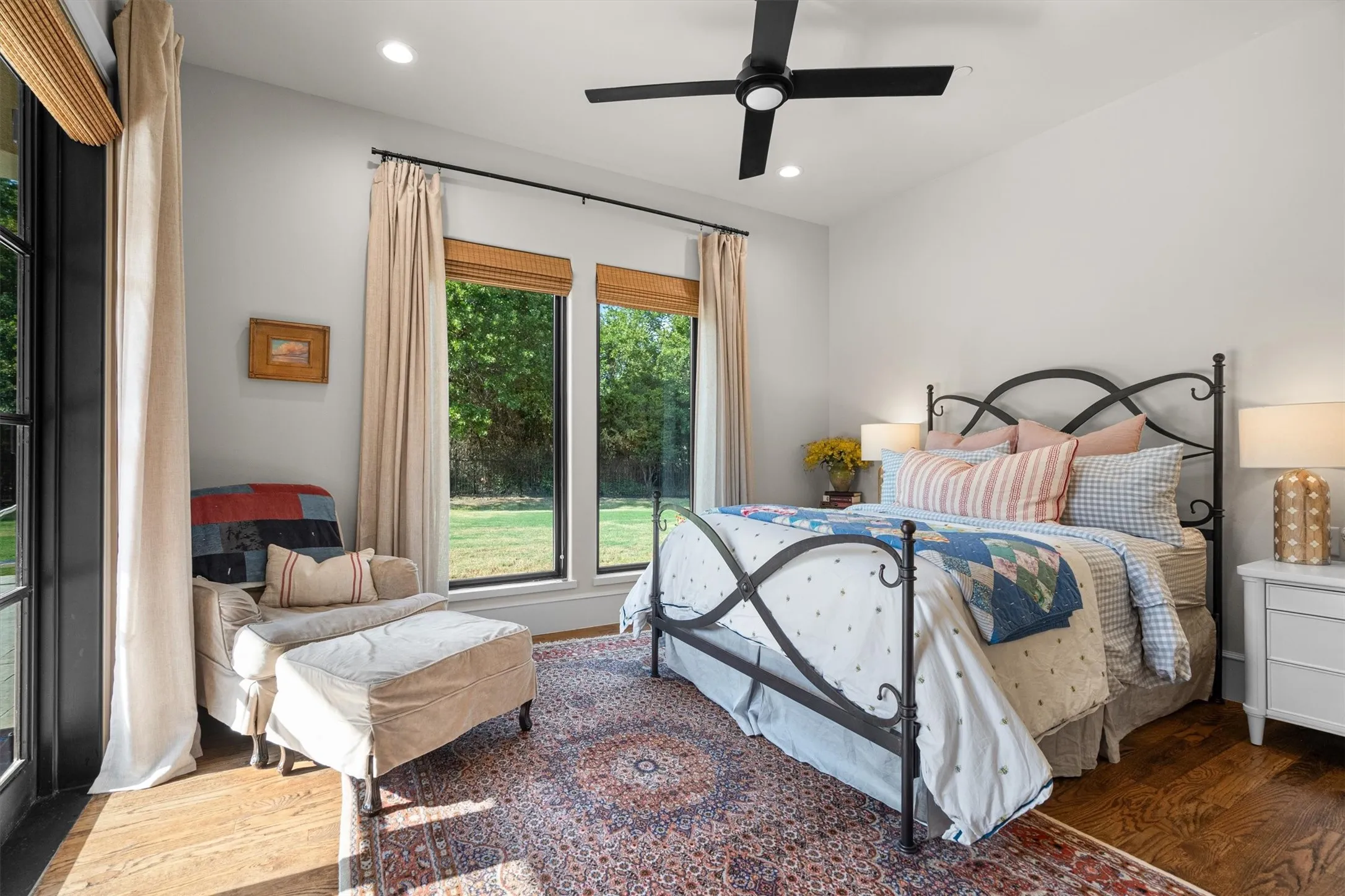 Secondary bedroom with direct patio access and abundant natural light.