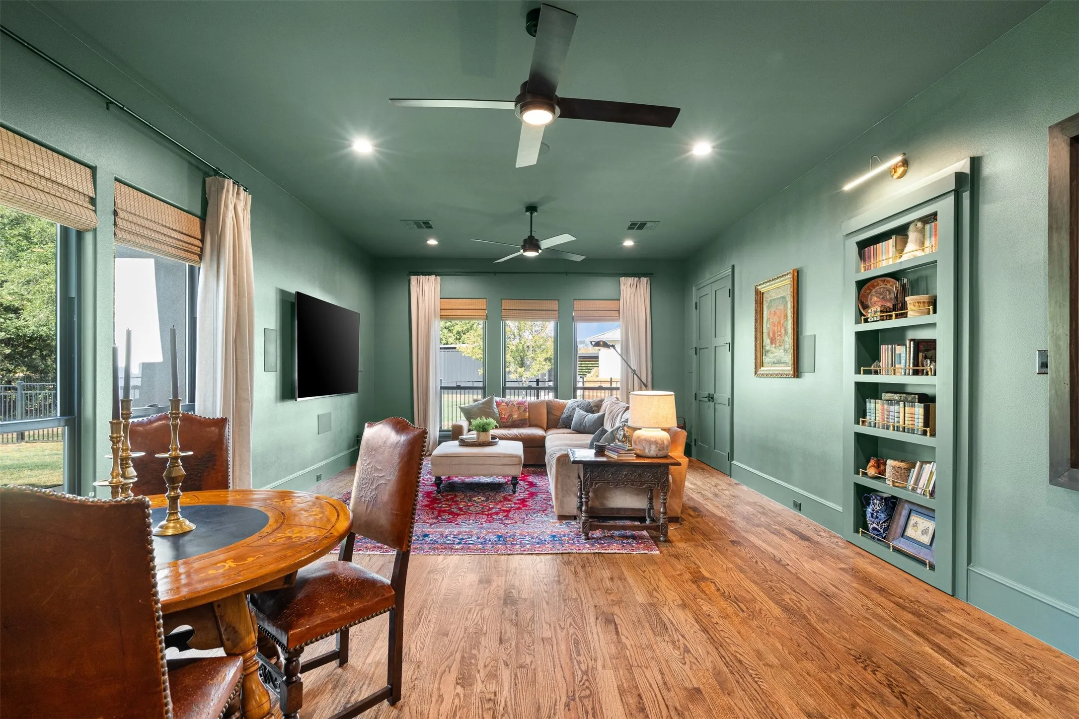 Versatile bonus room with built-in shelving and space for games or casual gatherings.
