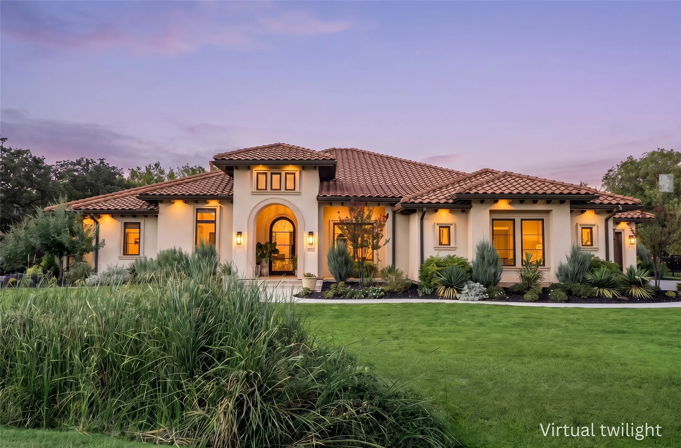 Stunning Mediterranean-style estate in Copper Canyon, TX — stucco facade, tile roofline, and warm twilight glow set on a sprawling lot.