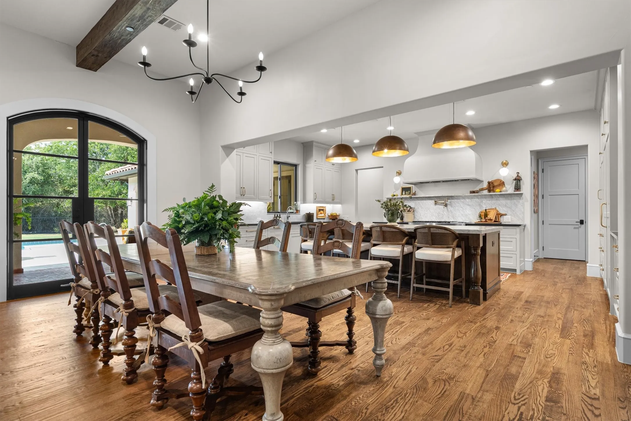 Formal dining space flows seamlessly into the gourmet kitchen — ideal for entertaining.