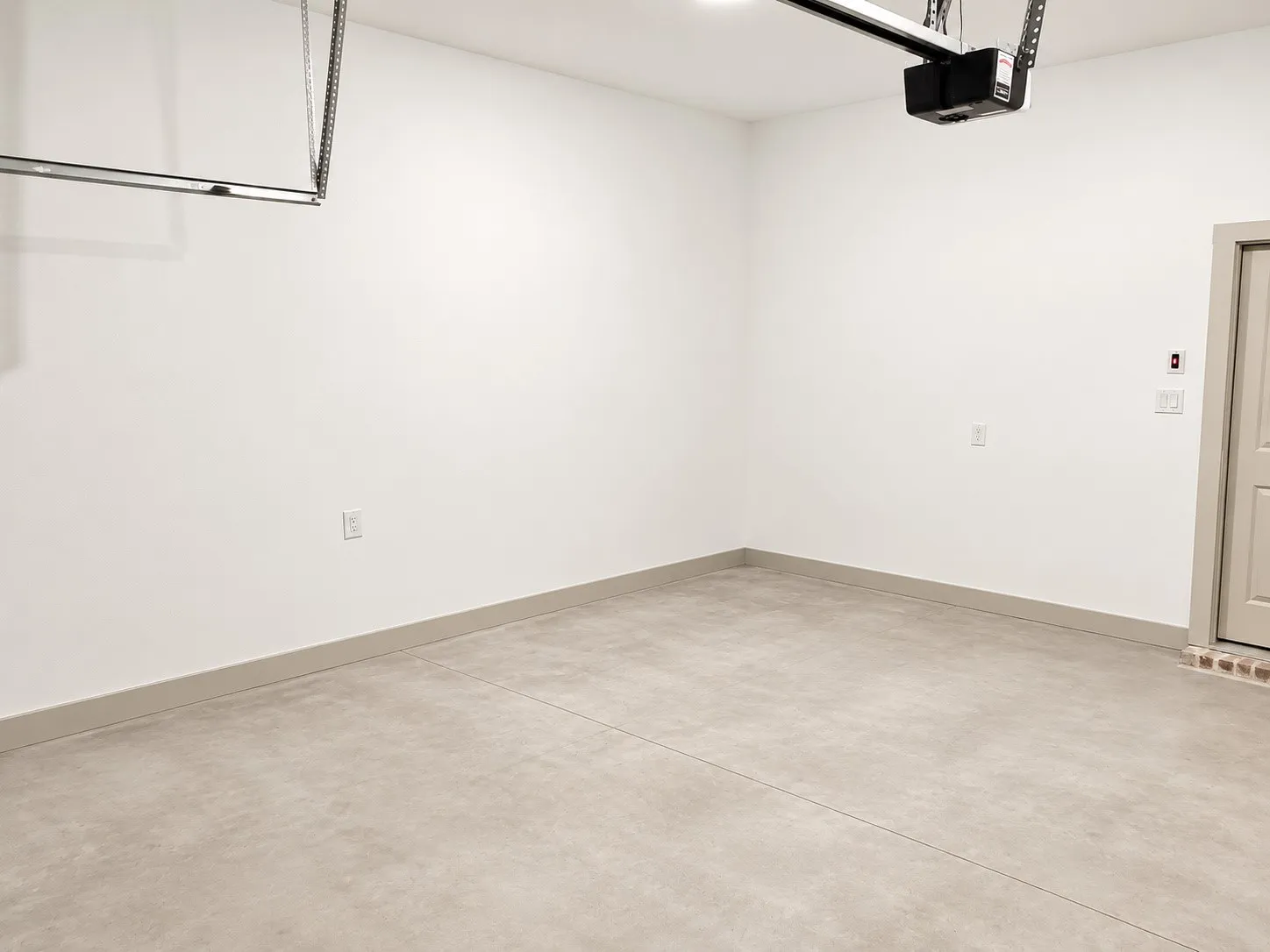 Concrete flooring and white painted walls