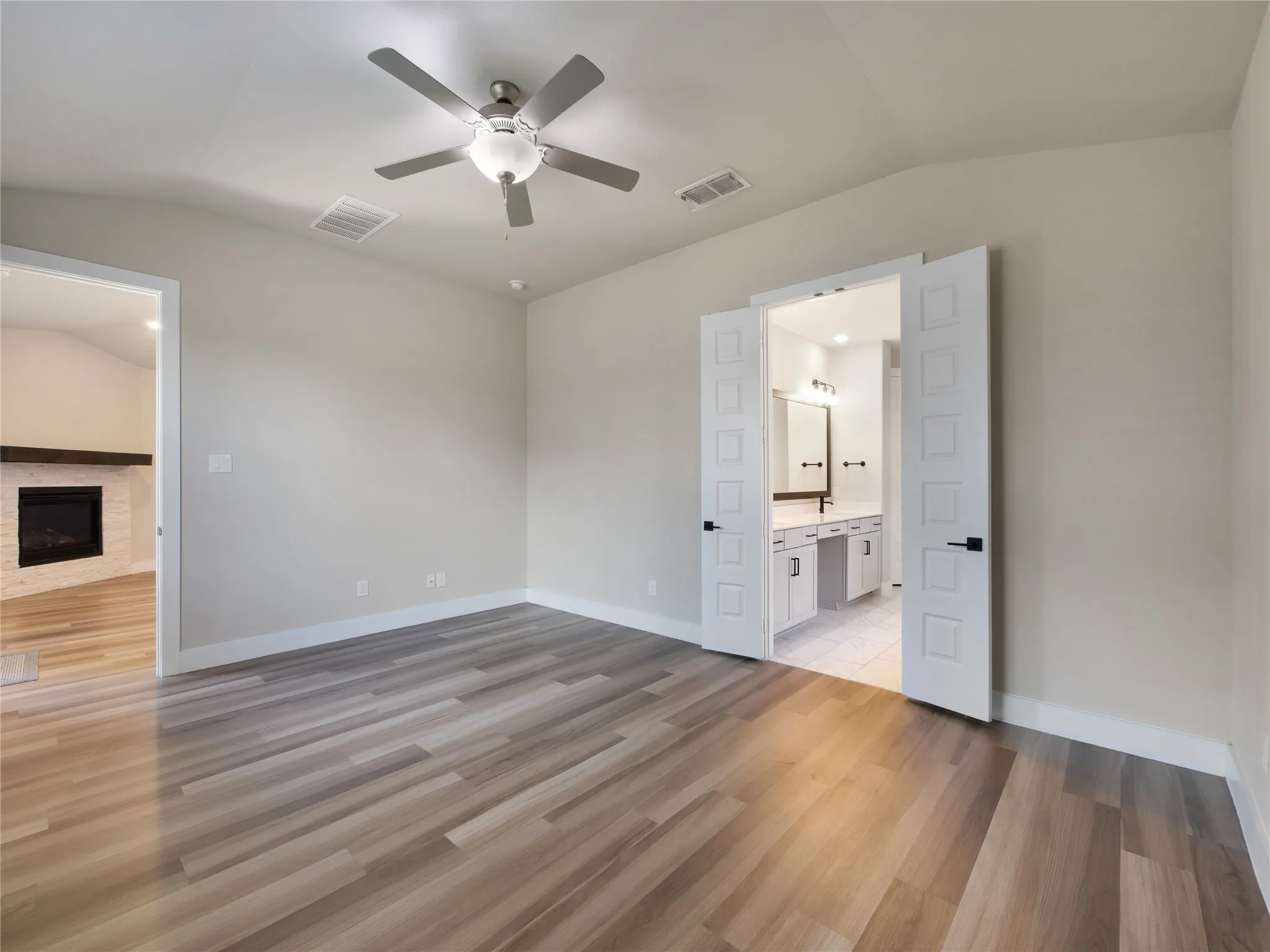 Primary bedroom opens to the family room and a beautiful ensuite bath.