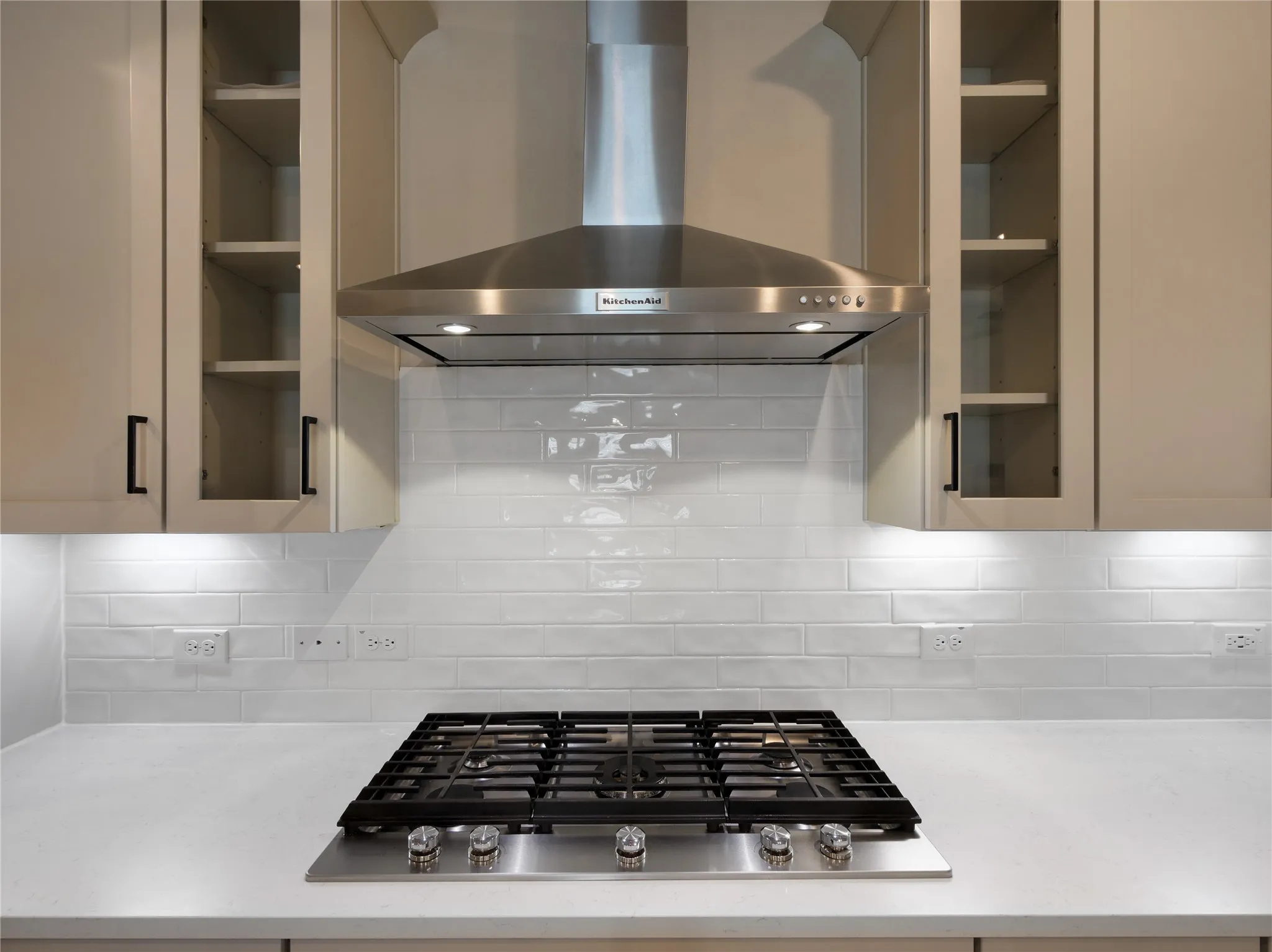 Stainless steel Kitche Aid Vent hood and five burner gas range.