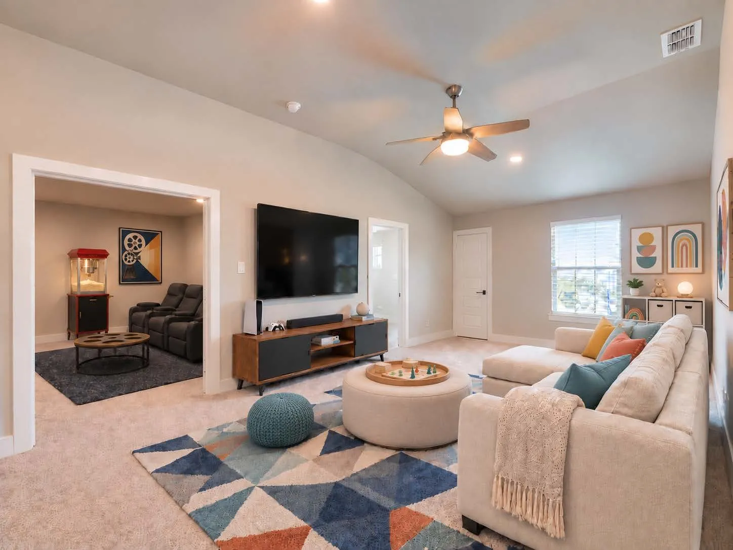Virtually staged by AI. Game room is centrally located between three bedrooms and media room.