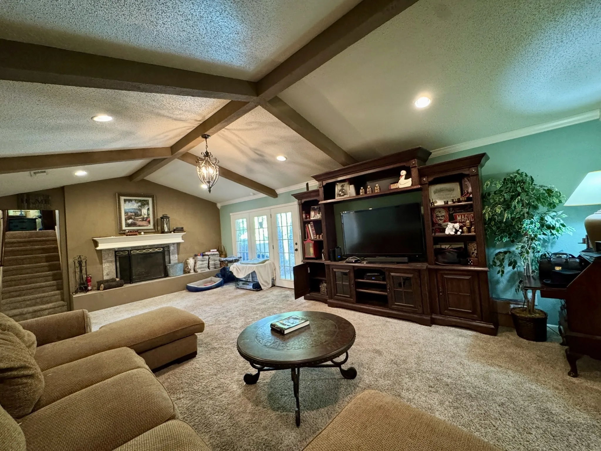 Floor to ceiling windows & door offer wonderful backyard views. Gas starter, wood burning fireplace great for winter weather. Stairs leading to the flex room above the garage.