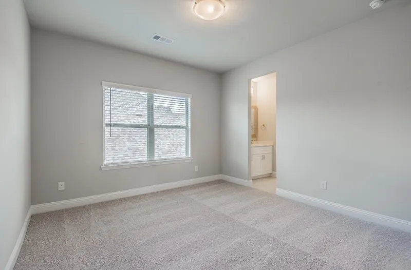 Carpeted flooring, neutral wall tones, recessed window, and flush mount lighting