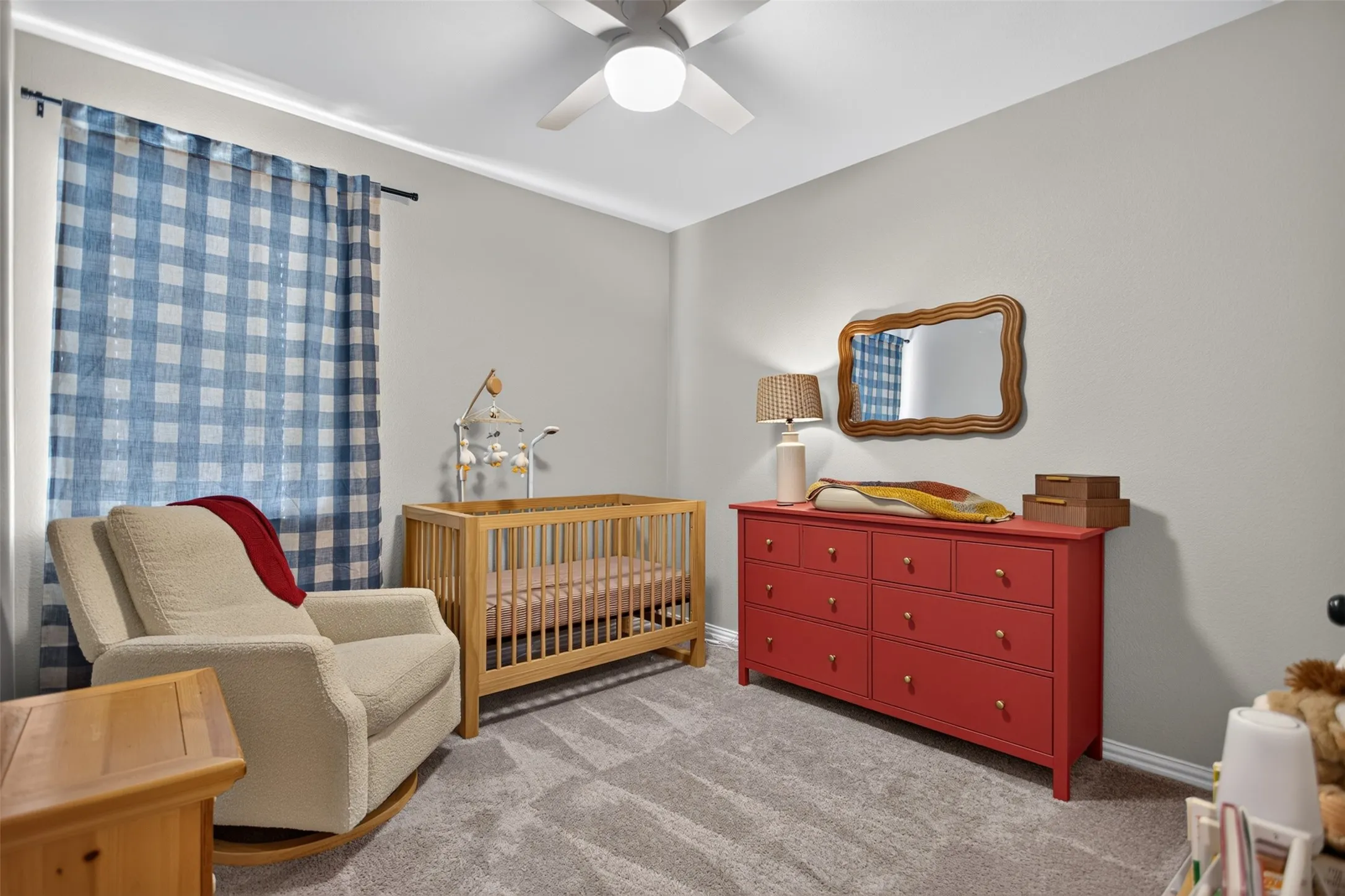 Plush gray carpeting with light gray walls, crown molding, and a ceiling fan