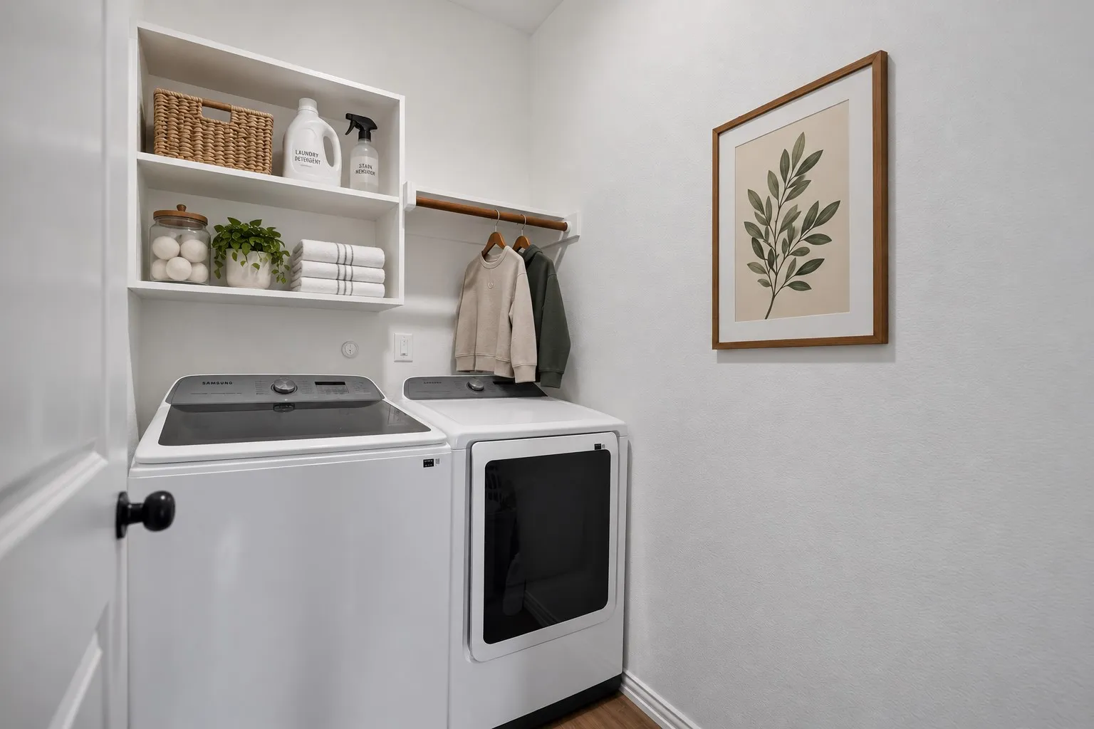 Built-in shelving, wood-finish flooring, and a mounted hanging rod