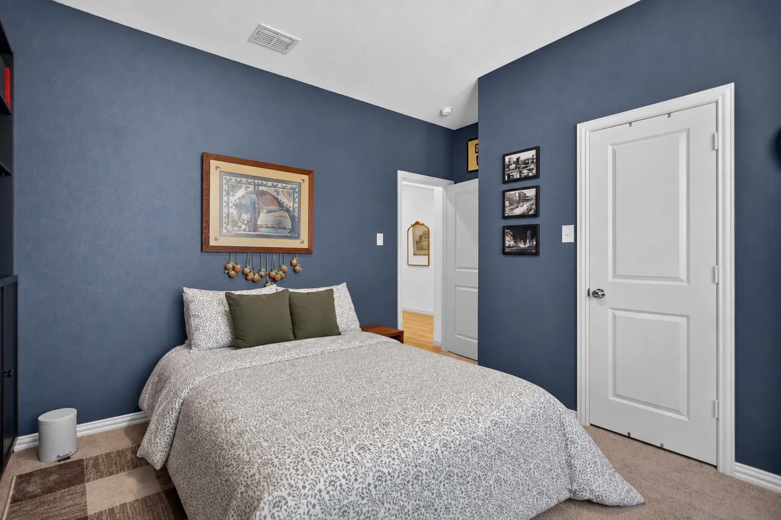 Carpeted flooring, painted walls, and white trim accents