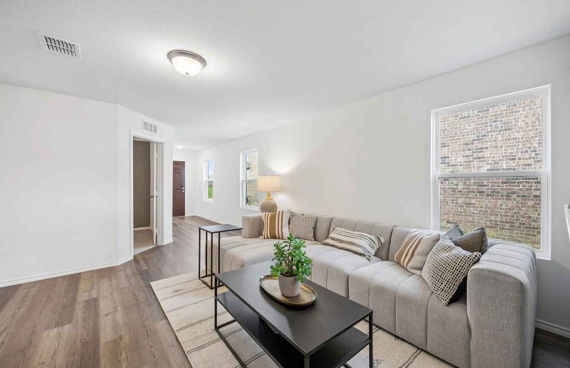 *Model Representation - Spacious gathering room with large windows