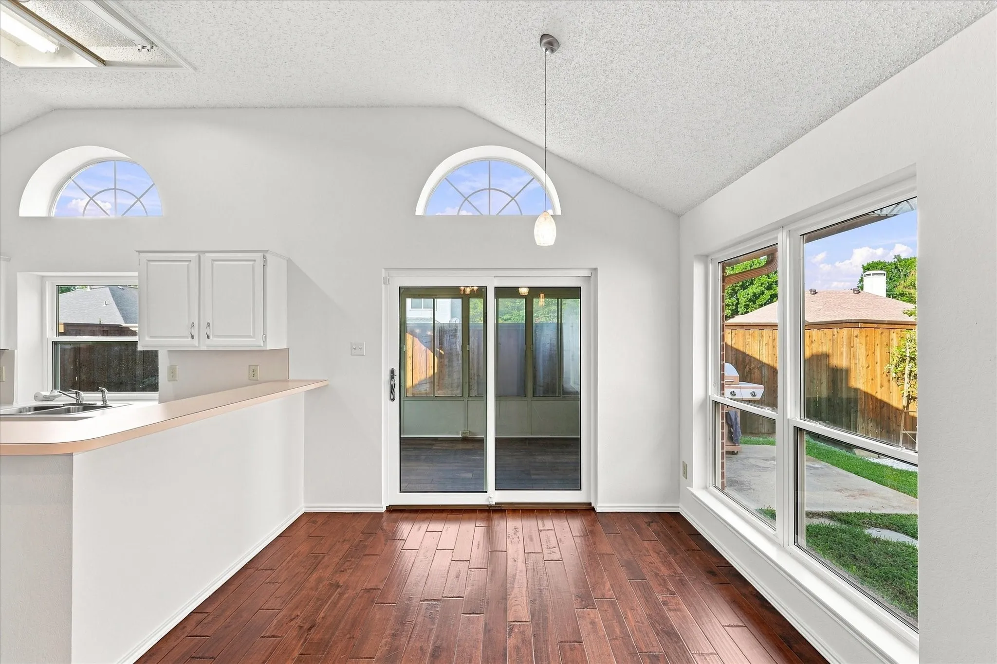 Dining area facing enclosed sunroom