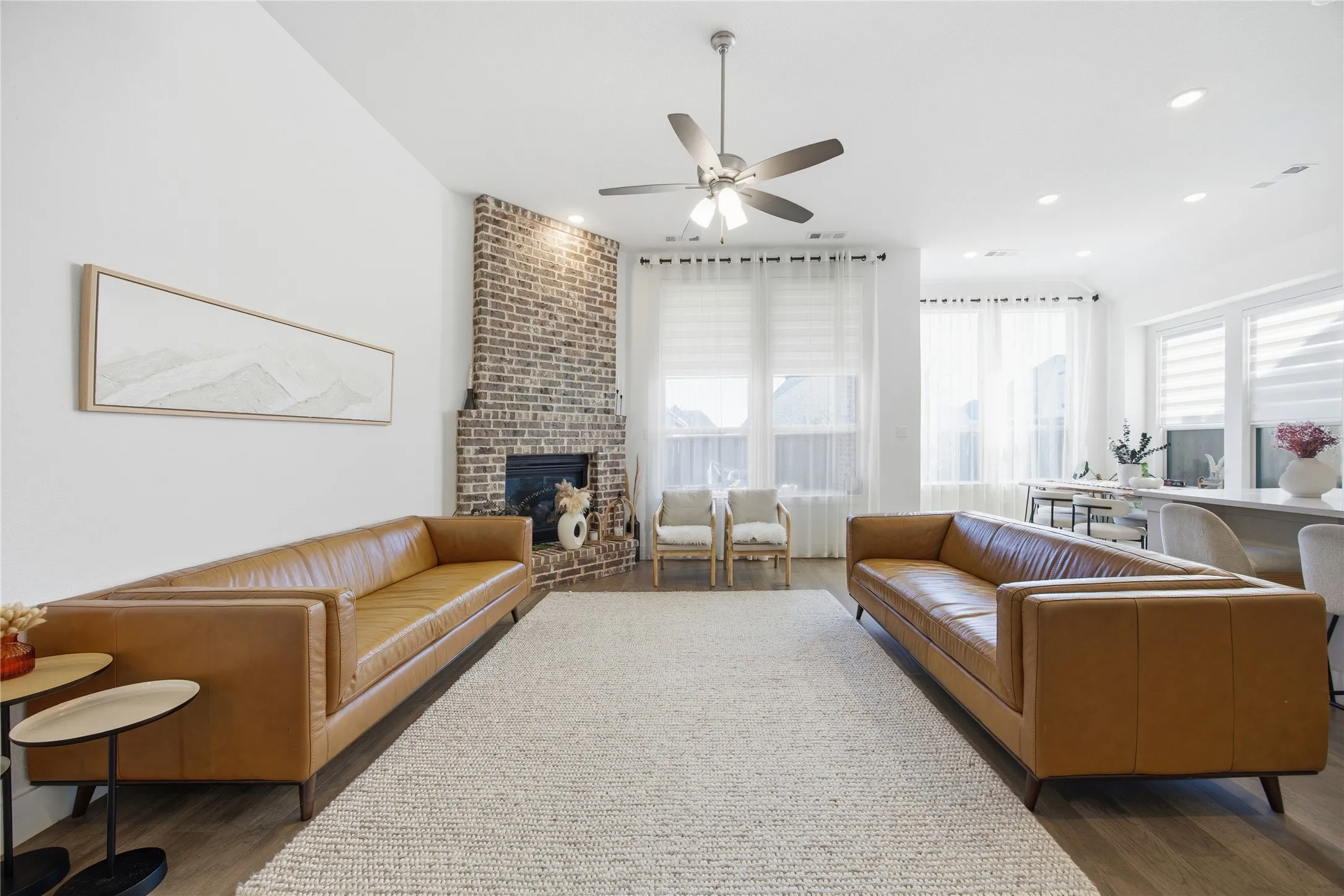 Wood-finish flooring, recessed lighting, and a ceiling fan