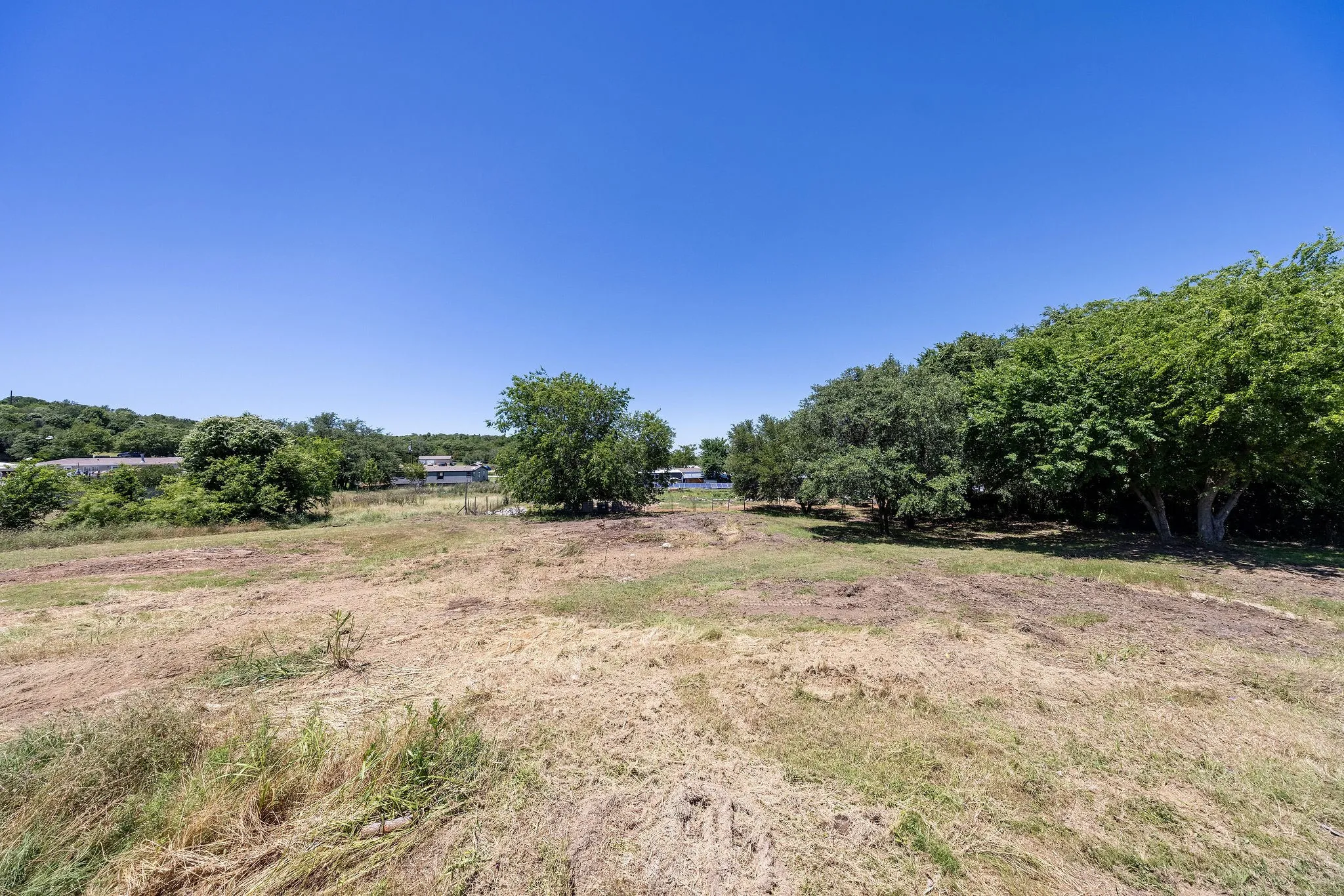 Expansive cleared lot with mature perimeter trees