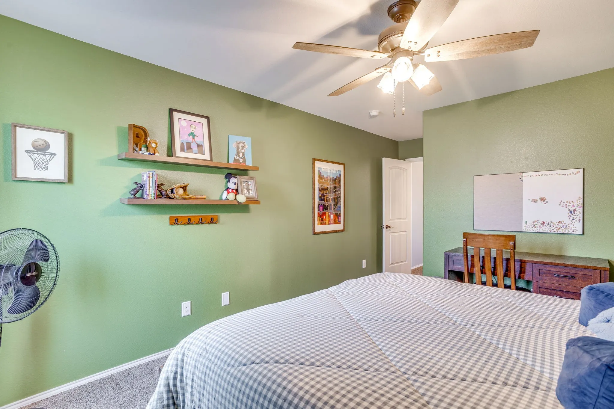 Recessed lighting, wood-finish ceiling fan, wood-finish floating shelves, and painted walls