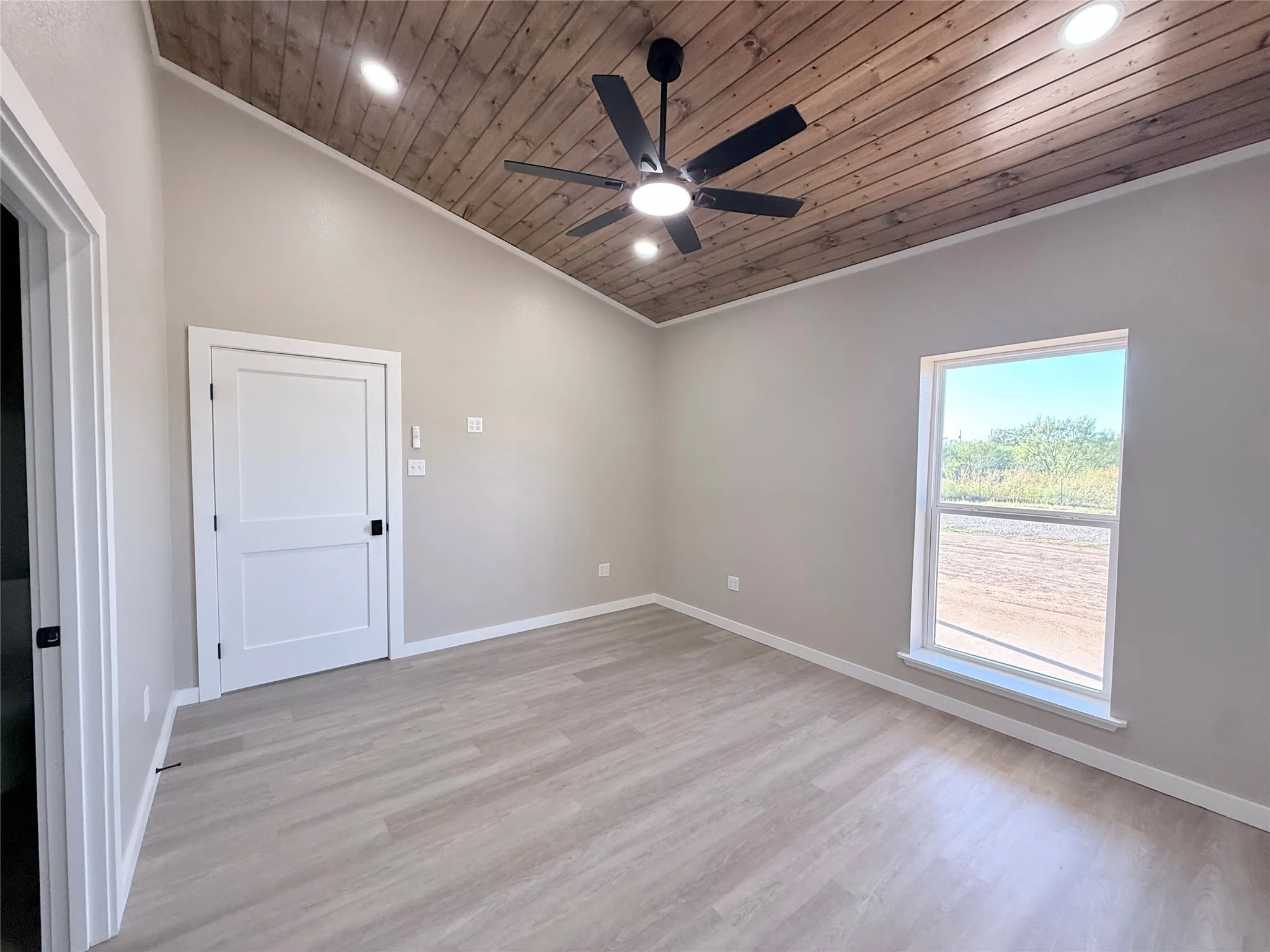 Primary suite with vaulted ceiling.