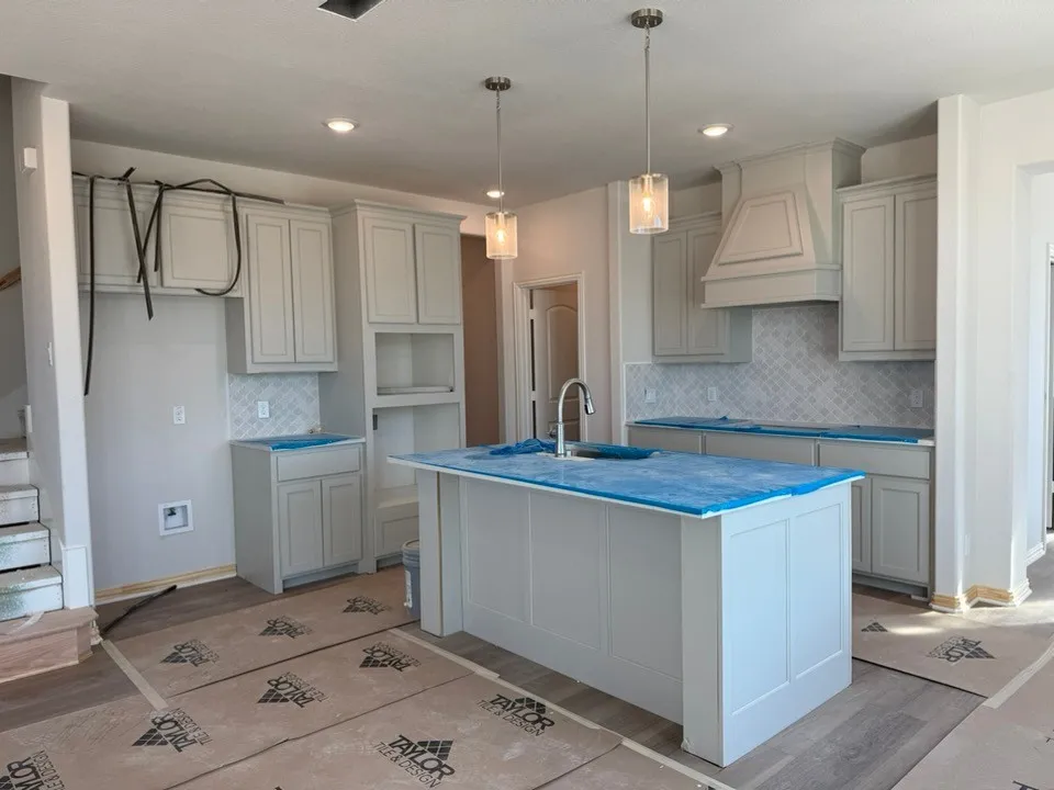 Kitchen featuring a center island, recessed lighting, pendant lighting, shaker-style cabinetry, and a tile backsplash