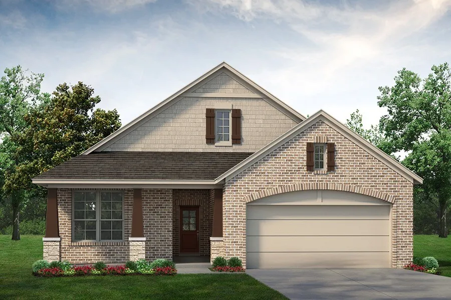 Brick and stone exterior with decorative columns, a prominent arched garage entrance, and a dark shingle roof