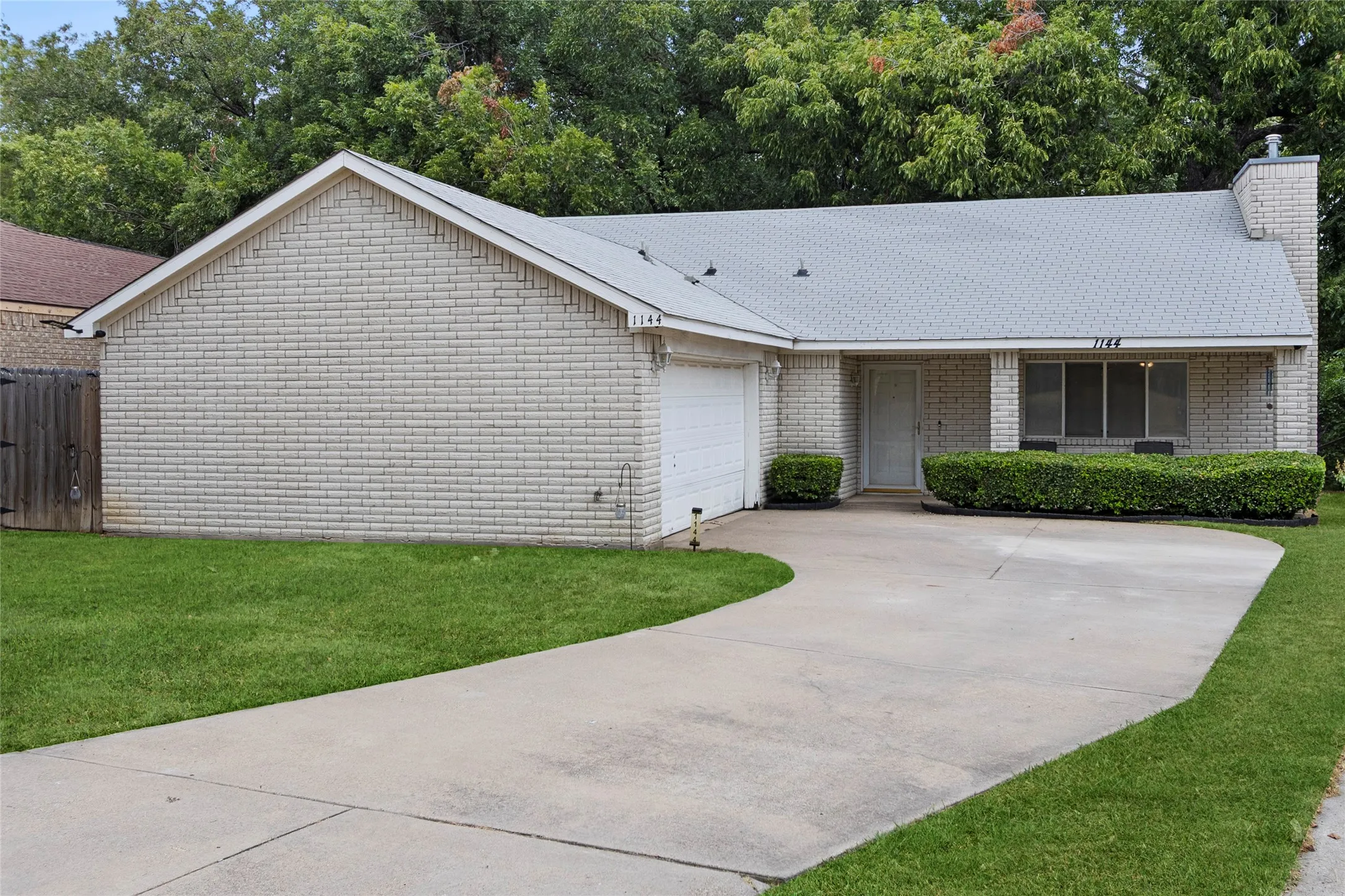 Brick exterior with attached garage