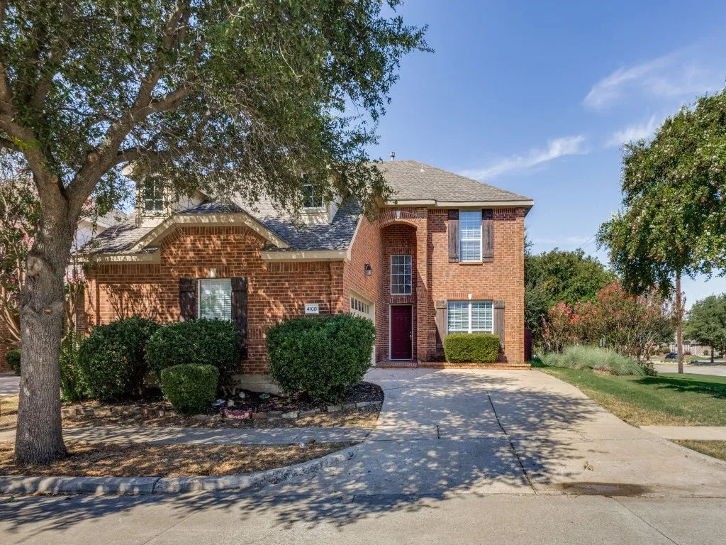 Traditional brick is timeless-with a prominent archway entry