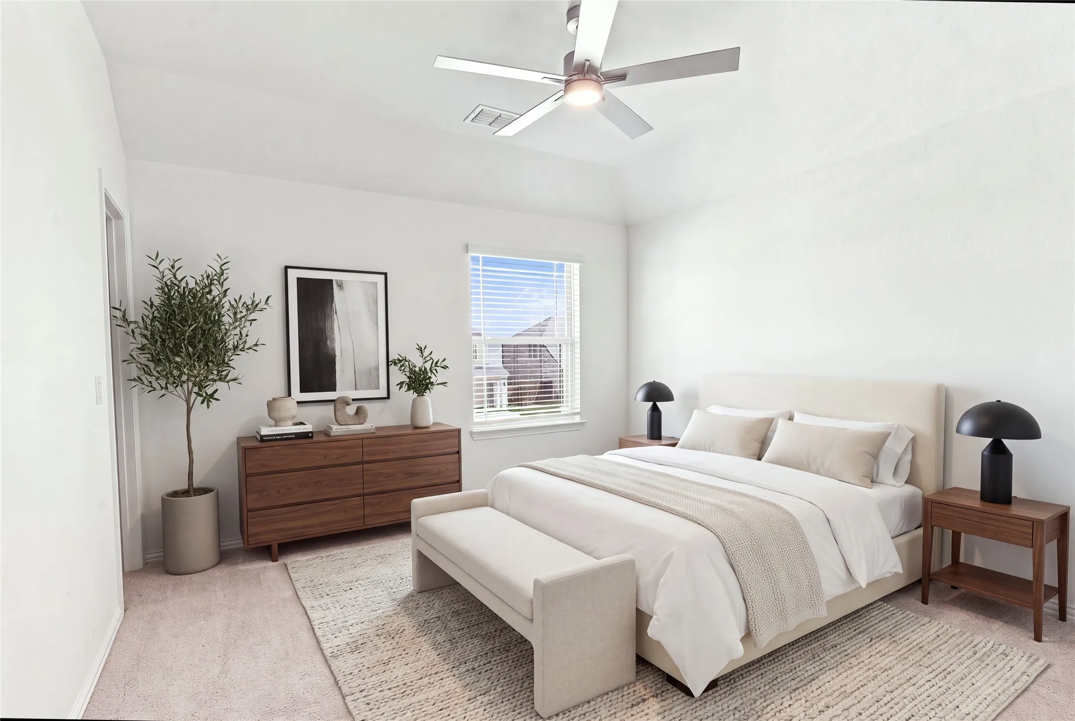 Vaulted ceiling with an attached ceiling fan, large window with blinds, and neutral carpeting