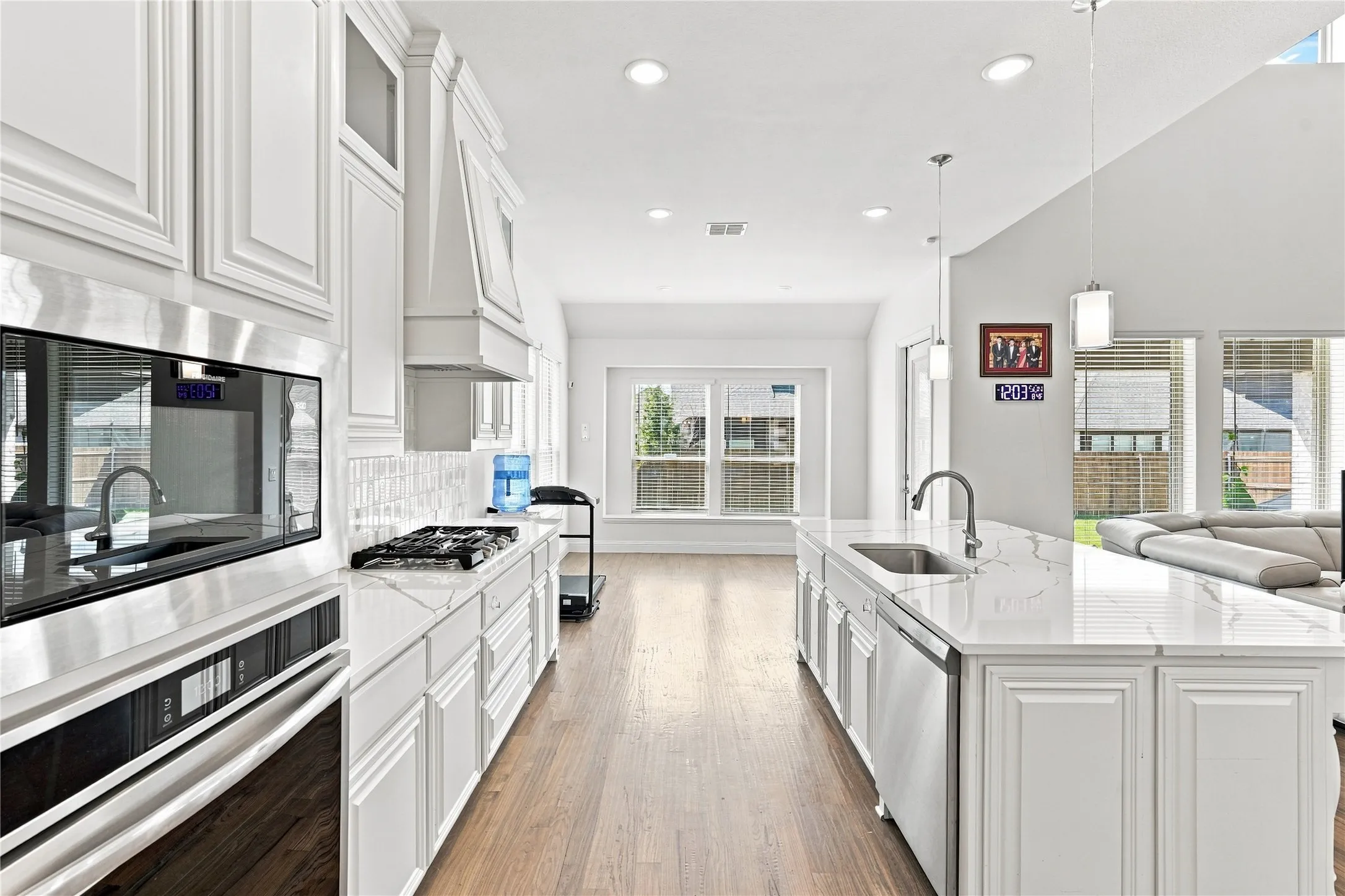 White paneled cabinetry with glass-front accents