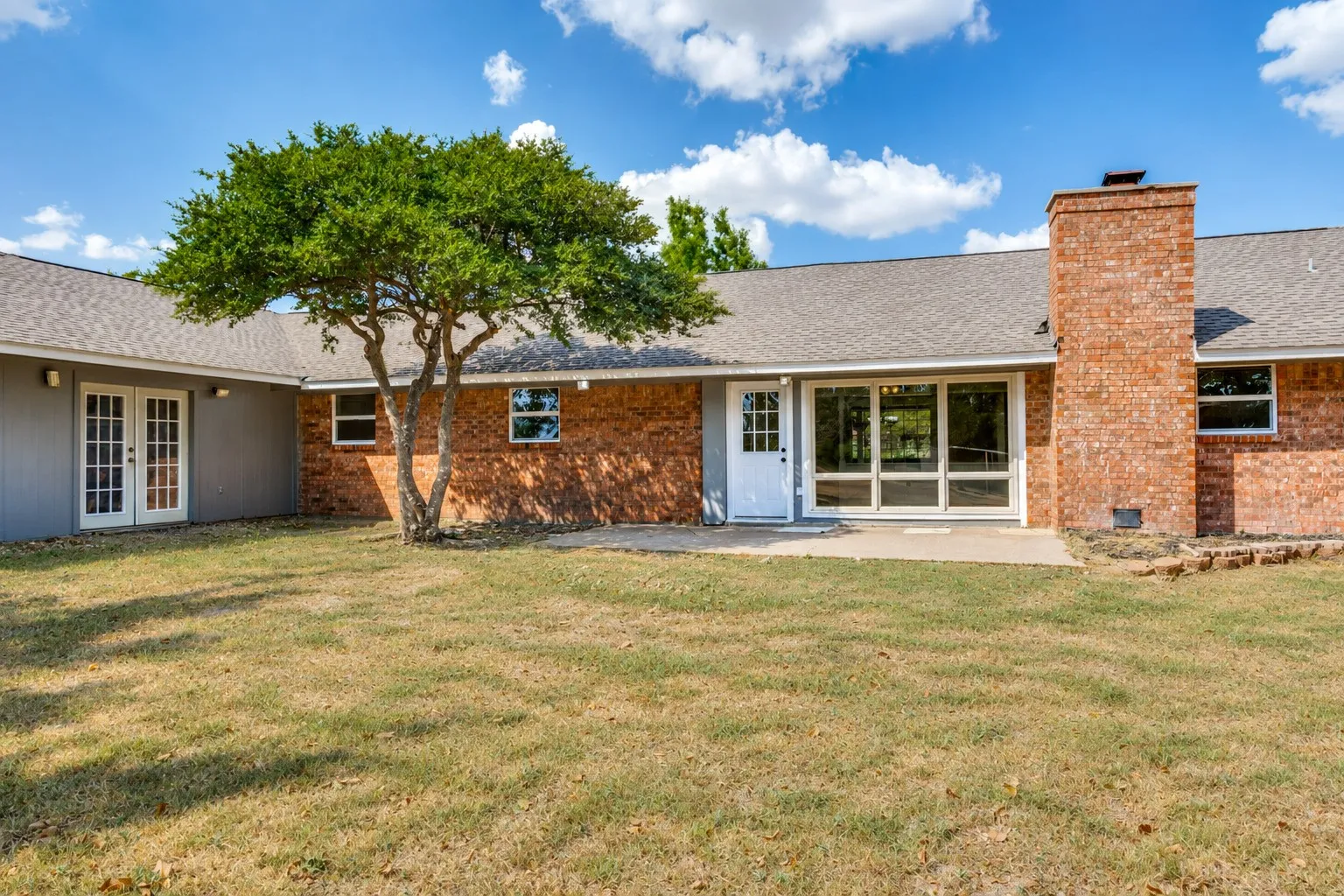 Brick exterior construction with a shingle roof