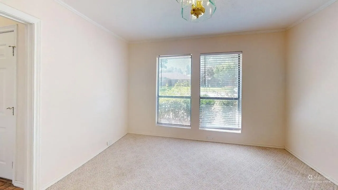 Recessed lighting fixture, carpeting, and two large windows with blinds