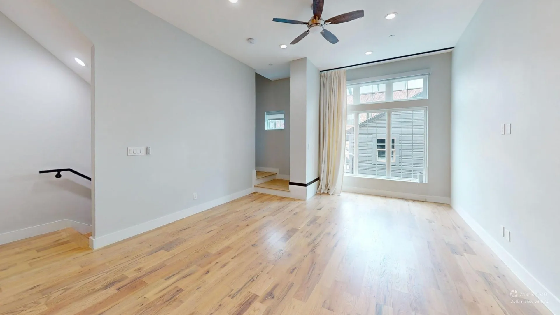 Hardwood-finish flooring, recessed lighting, and a ceiling fan