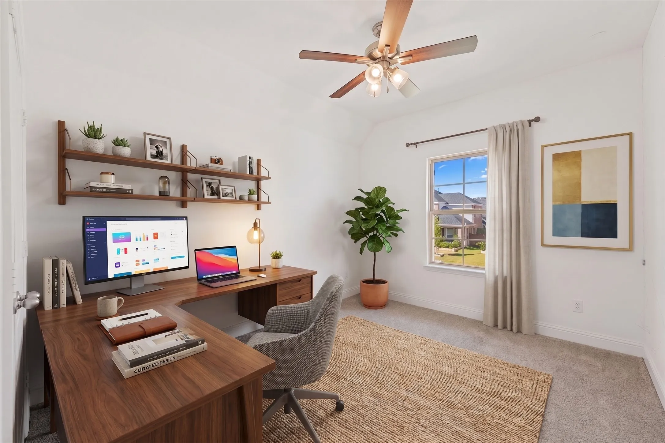 Integrated shelving unit above a wood-finish desk
