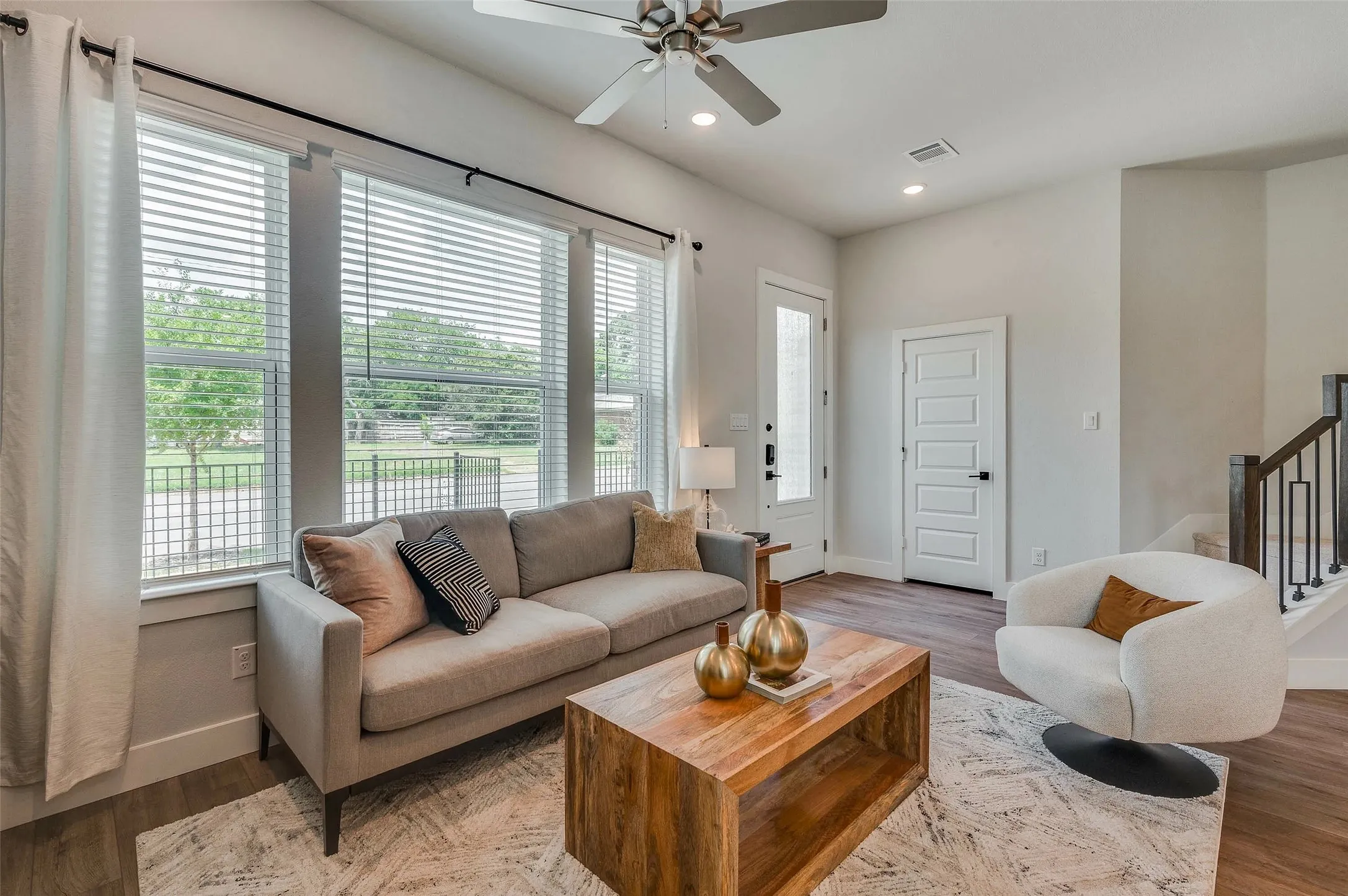 Wood-finish flooring, recessed lighting, and a ceiling fan