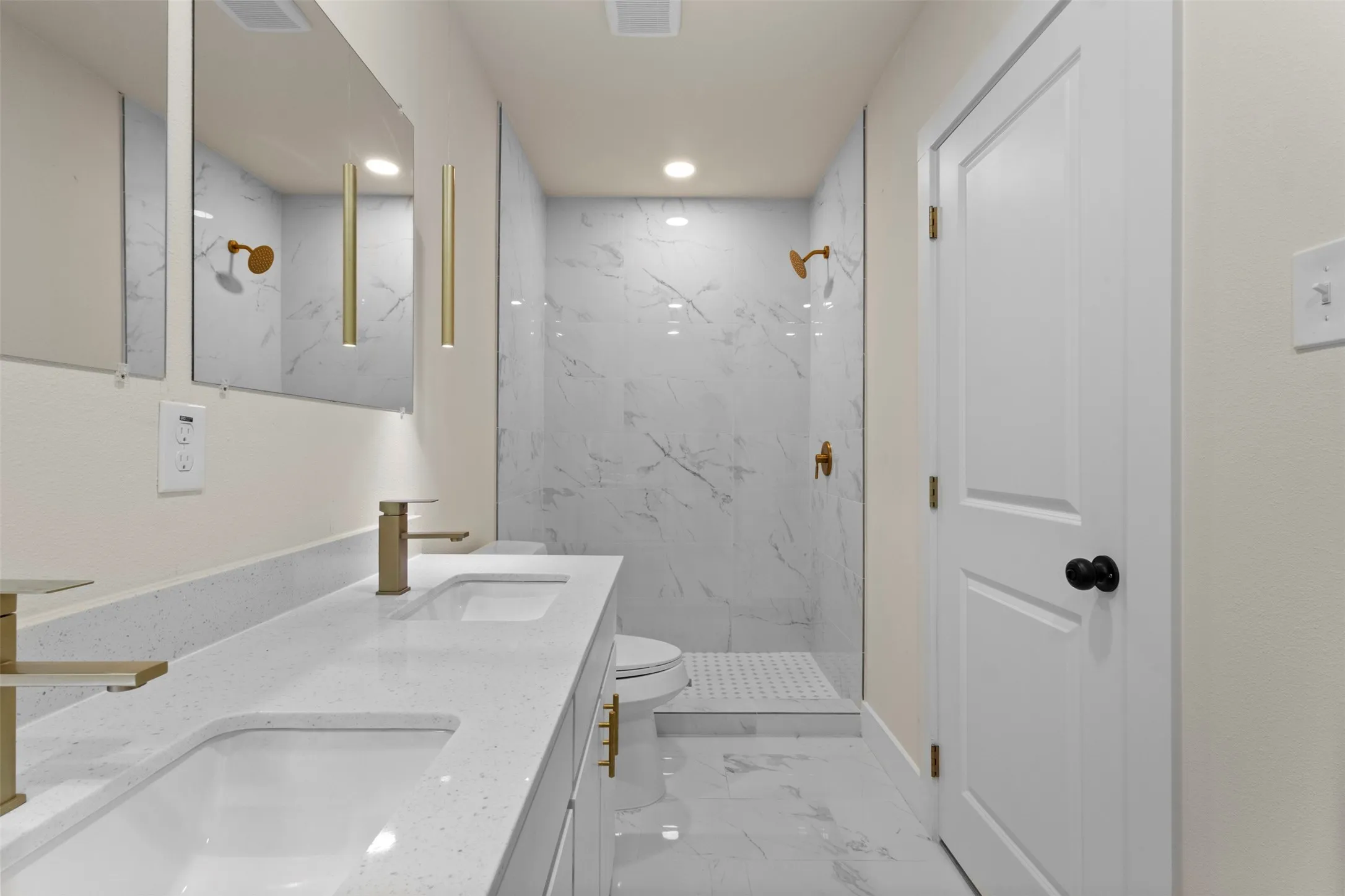 Dual under-mount sinks with quartz-finish countertop