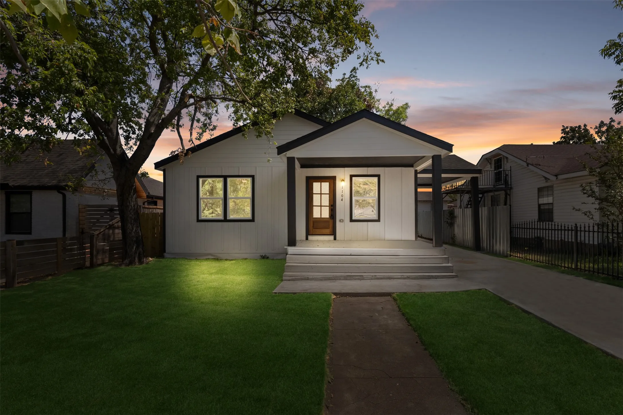 Modern facade with white horizontal siding and black trim