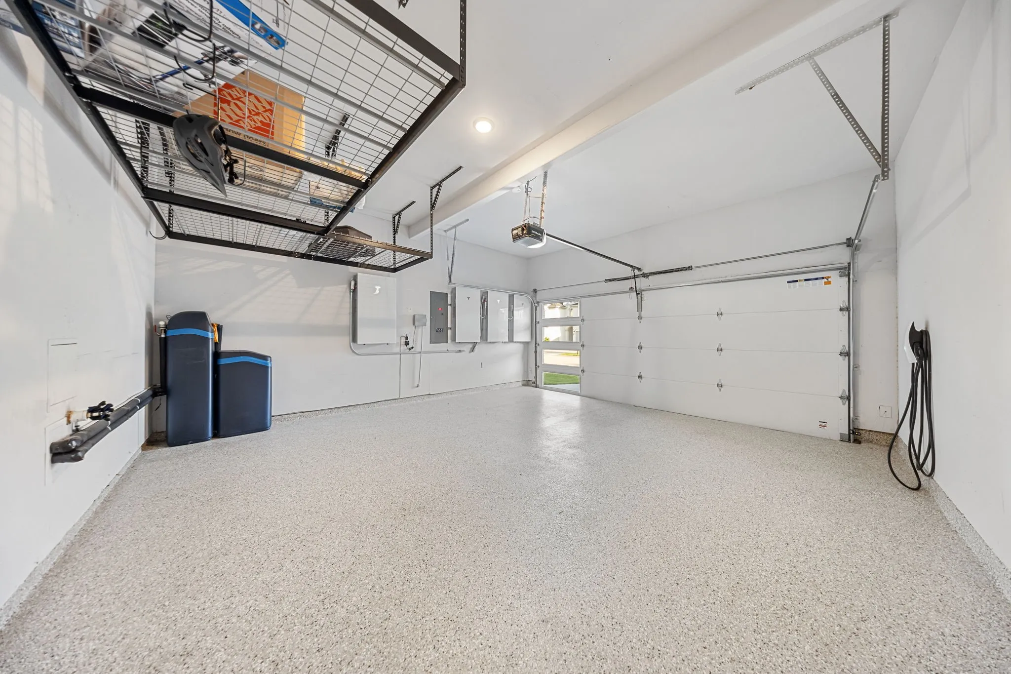 Equipted with solar panels, EV charger, epoxy floor, and Ecowater system.
