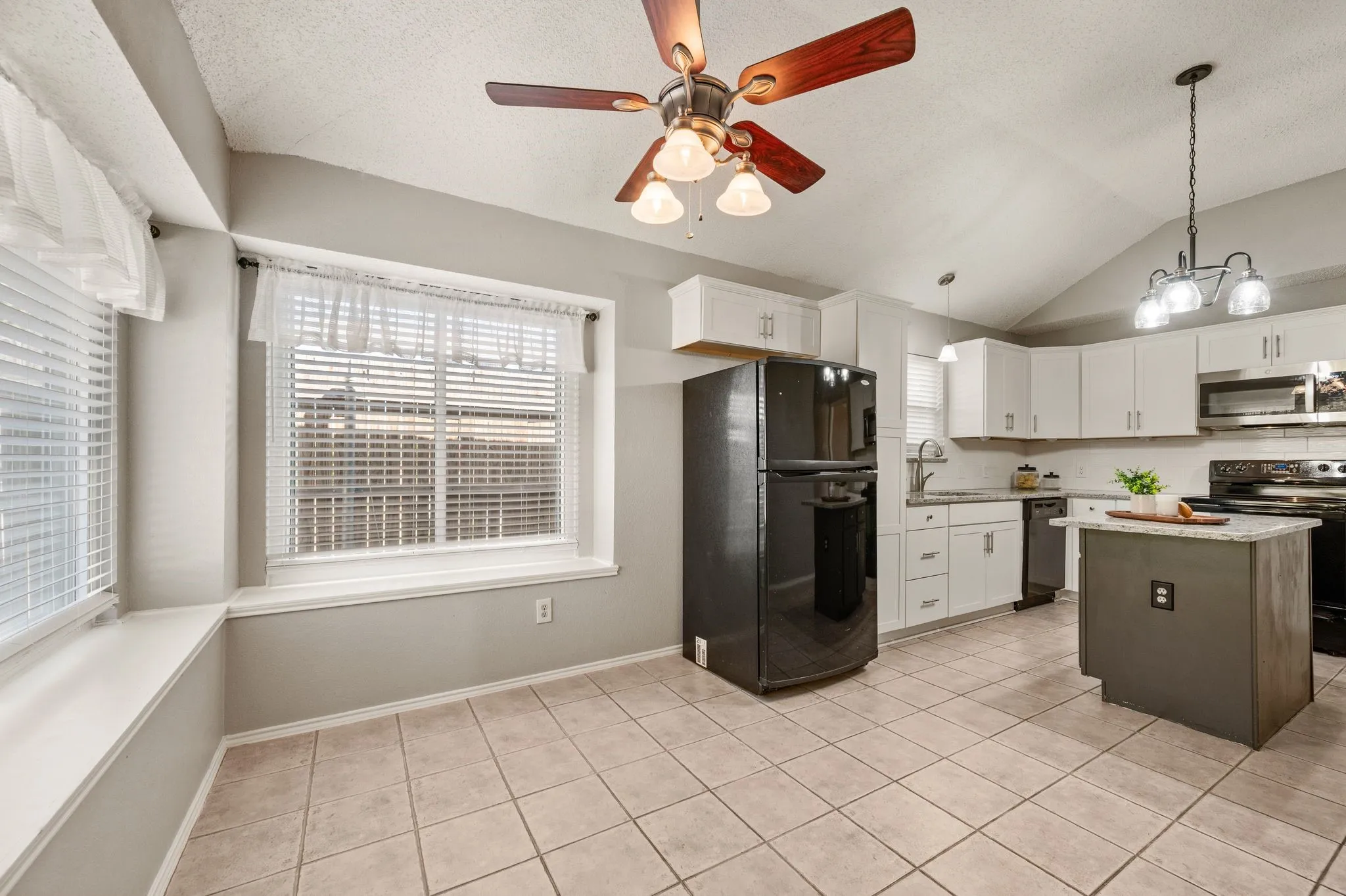 Spacious breakfast area provides the perfect spot for casual meals beside abundant natural light.