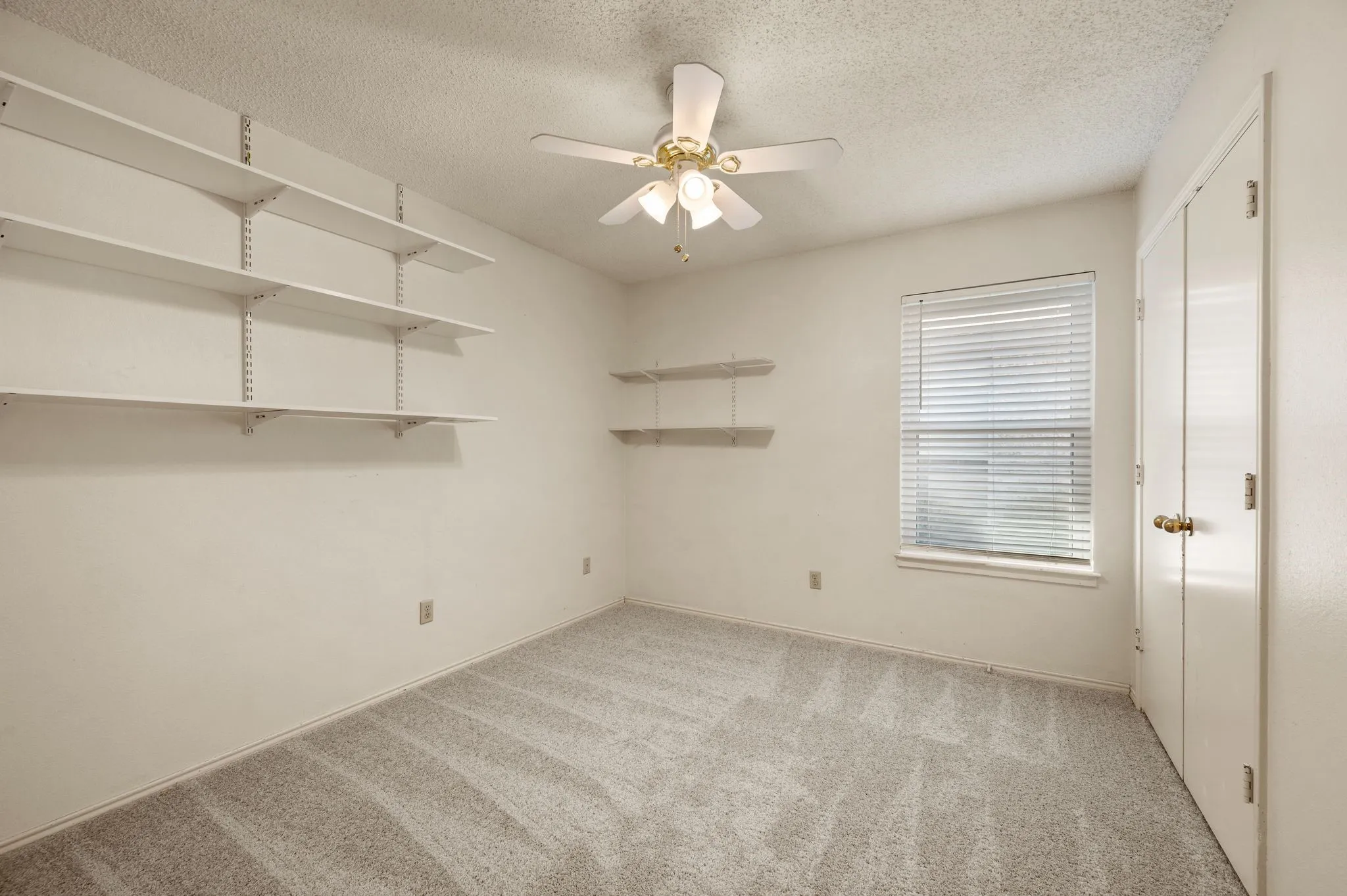 Versatile secondary bedroom features new  carpet.