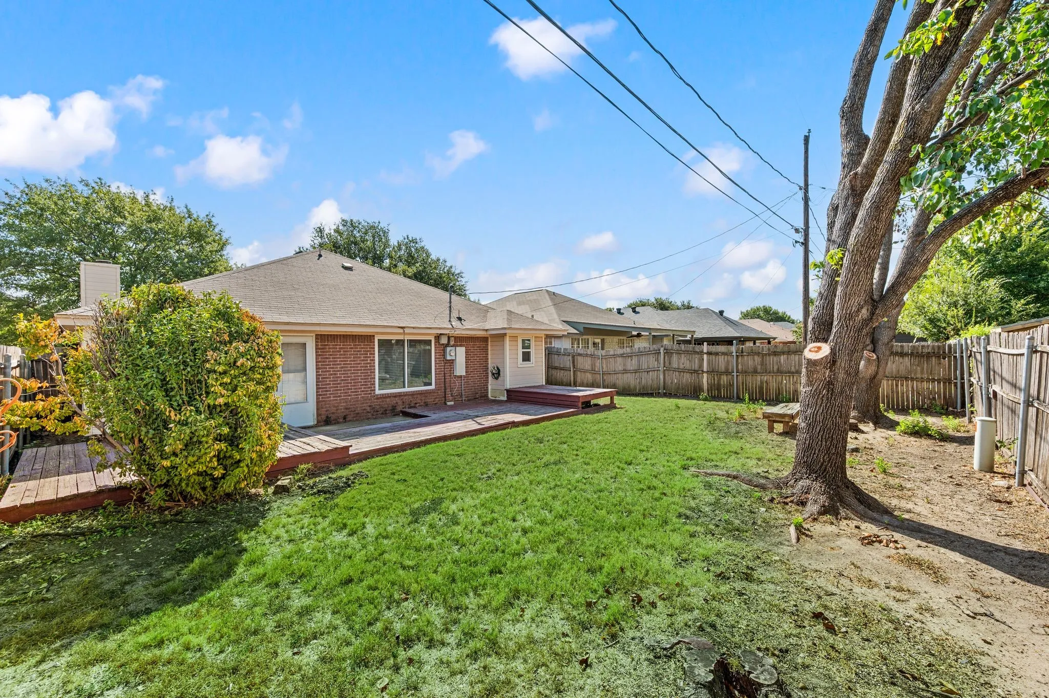 Mature trees provide welcome shade throughout the roomy backyard.
