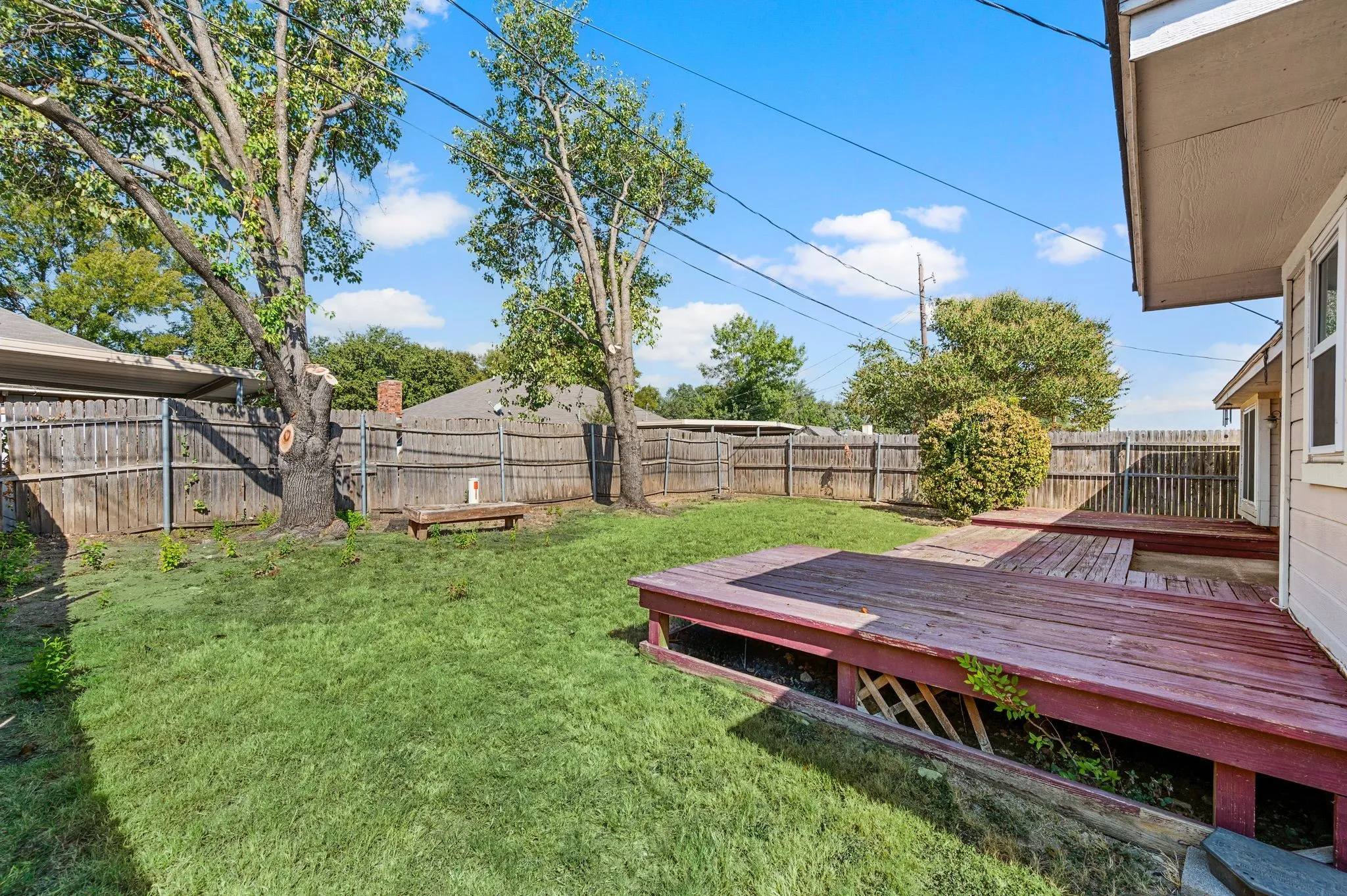 Spacious fenced backyard provides room to play, garden or relax.