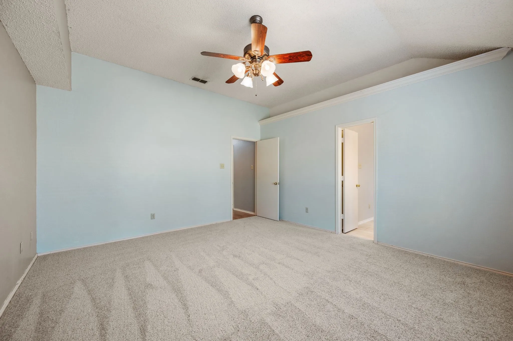 Another view of the generously sized primary suite with plenty of space to make it your own.