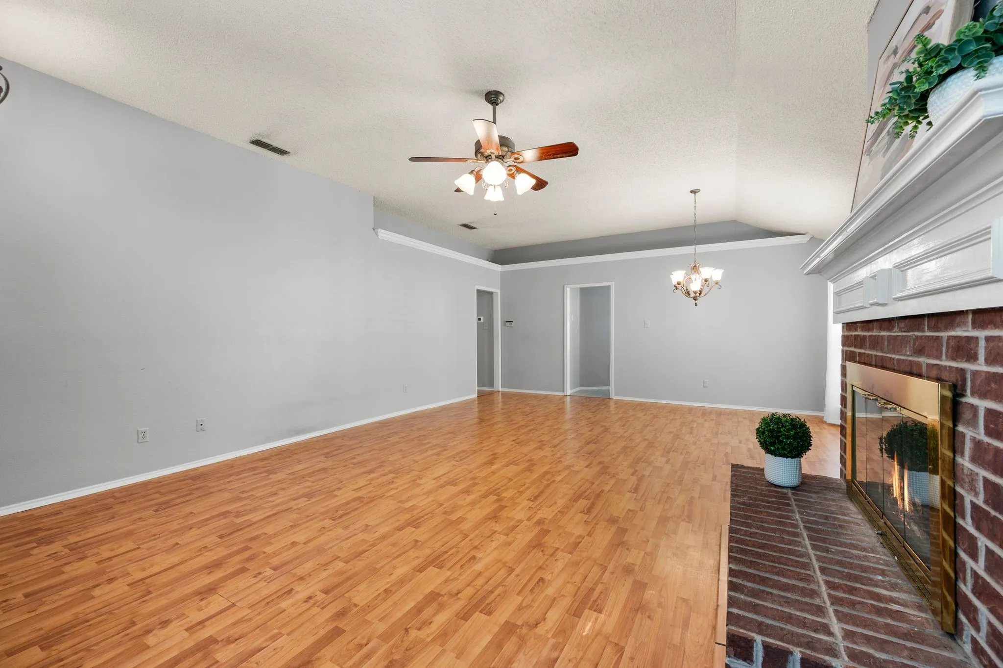 Cozy brick fireplace creates a welcoming focal point in the living room.